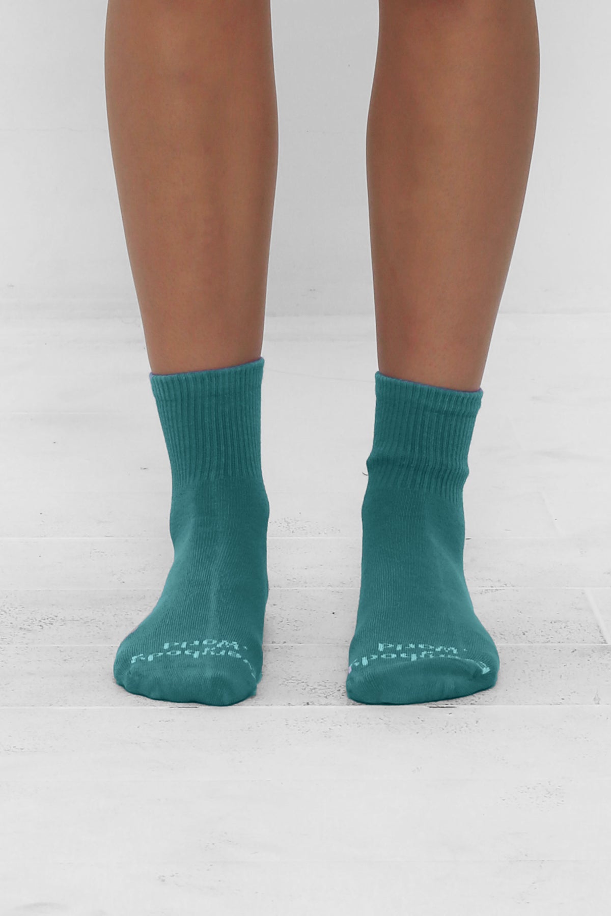 Oyster Spring Socks, branded 'Everybody.World' in white, ankle-high, shown on lower legs.