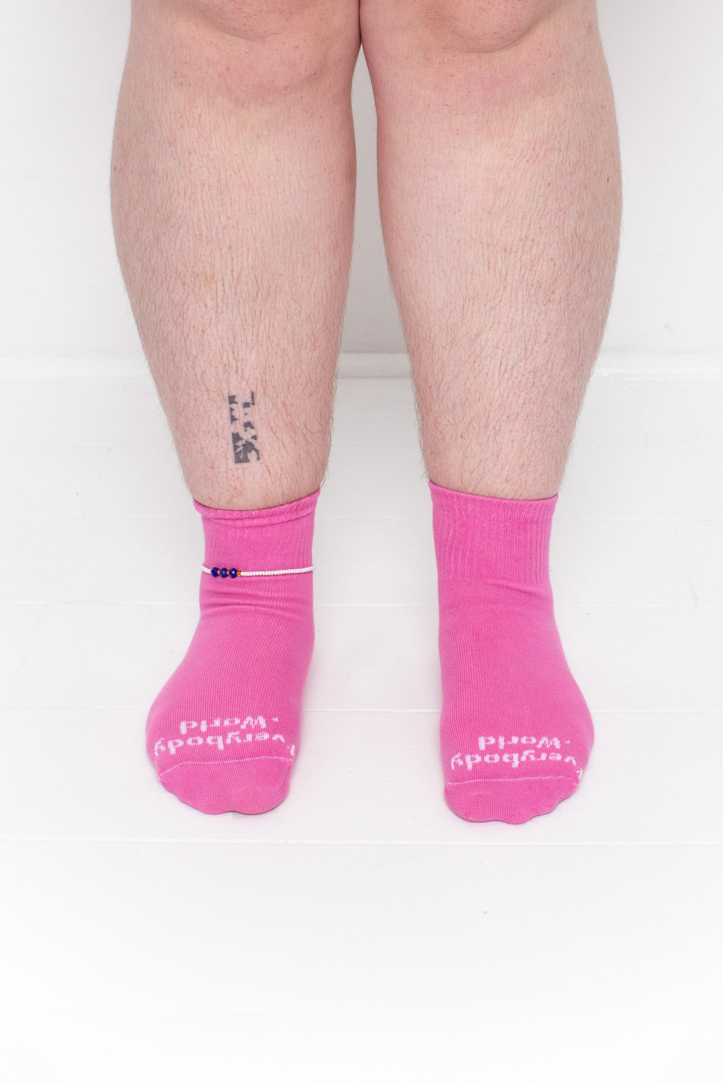 Pixie Spring Socks, branded 'Everybody.World' in white, are ankle-high, shown on a person's lower legs.