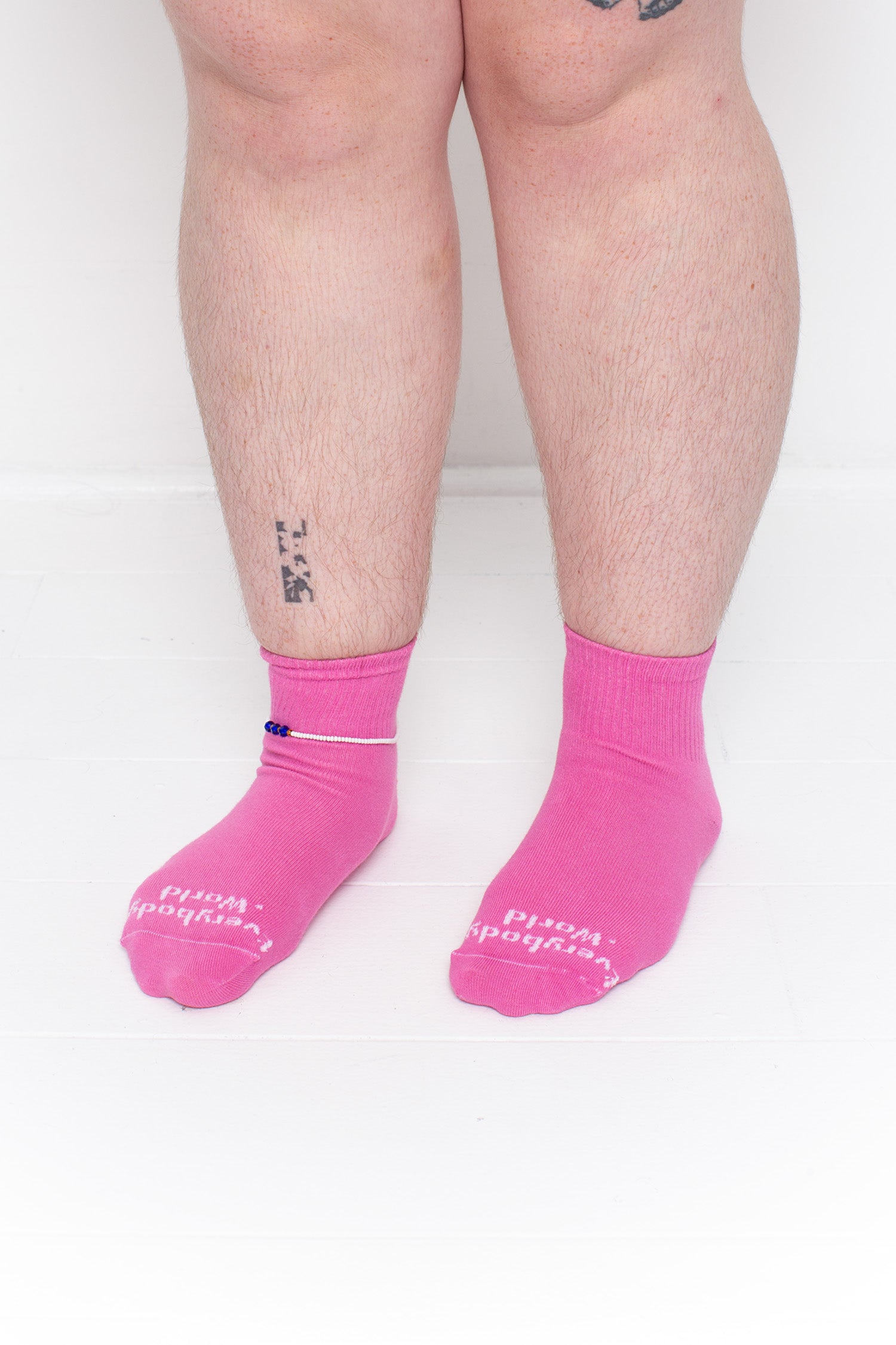 Pixie Spring Socks, branded 'Everybody.World,' shown on a person's lower legs pointing 45-degrees.