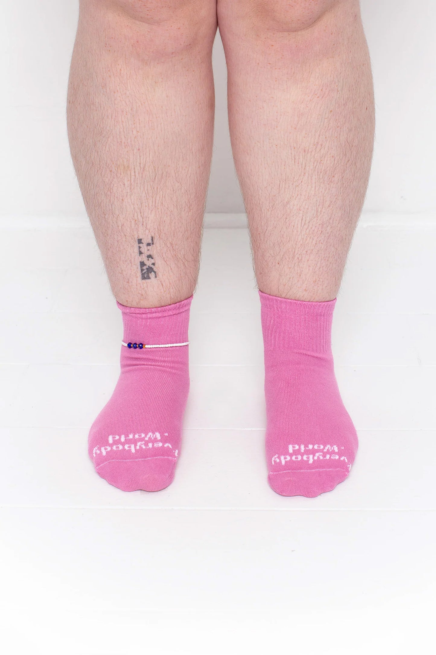 Pixie Spring Socks, branded 'Everybody.World' in white, ankle-high, shown on lower legs.