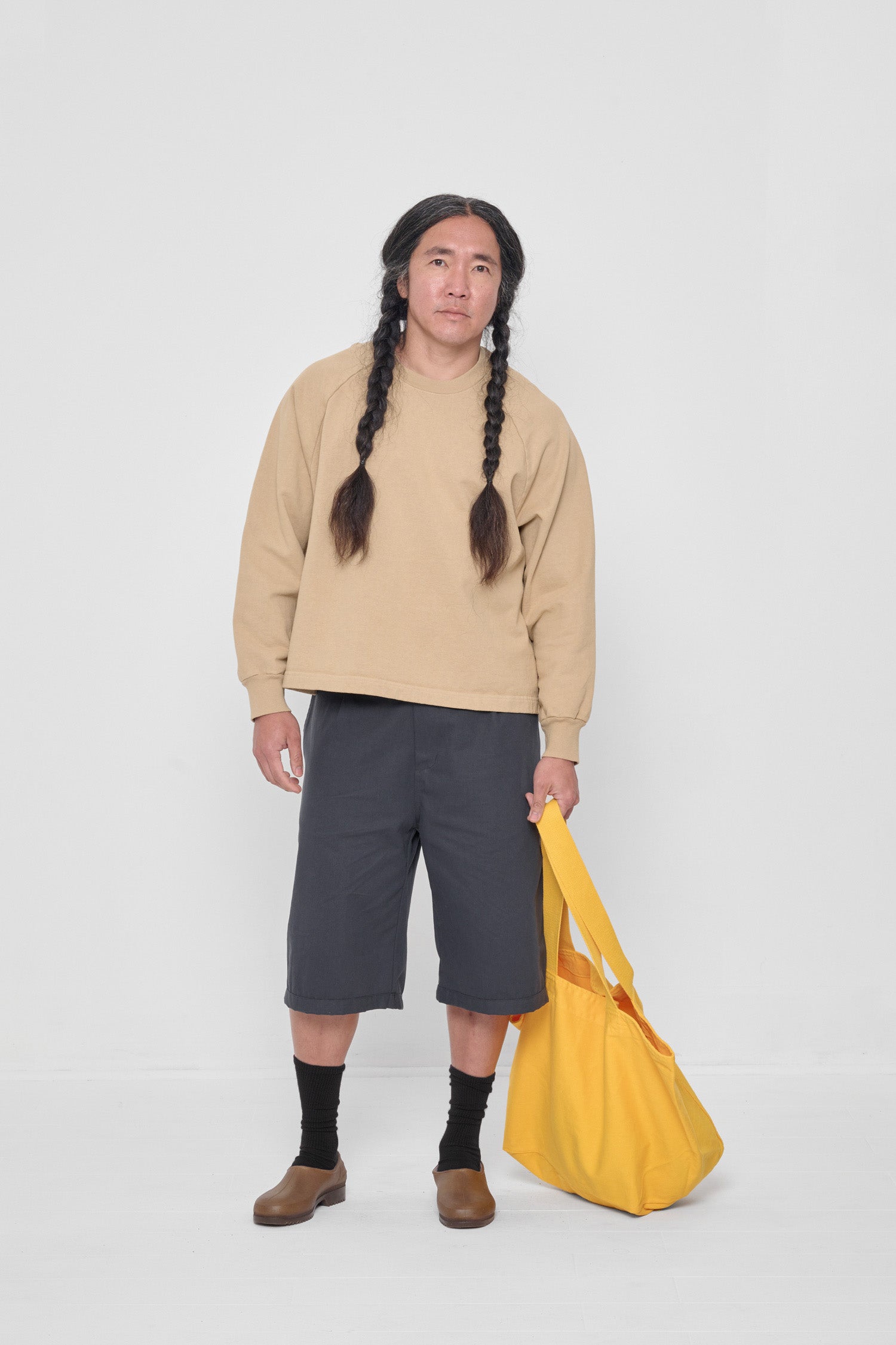 Styled with Sand Storm Trash Crewneck and Slate Bermuda Shorts.