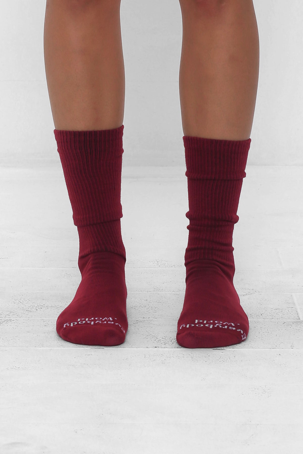 Garnet Socks, branded 'Everybody.World' in white at the toe, mid-calf high.