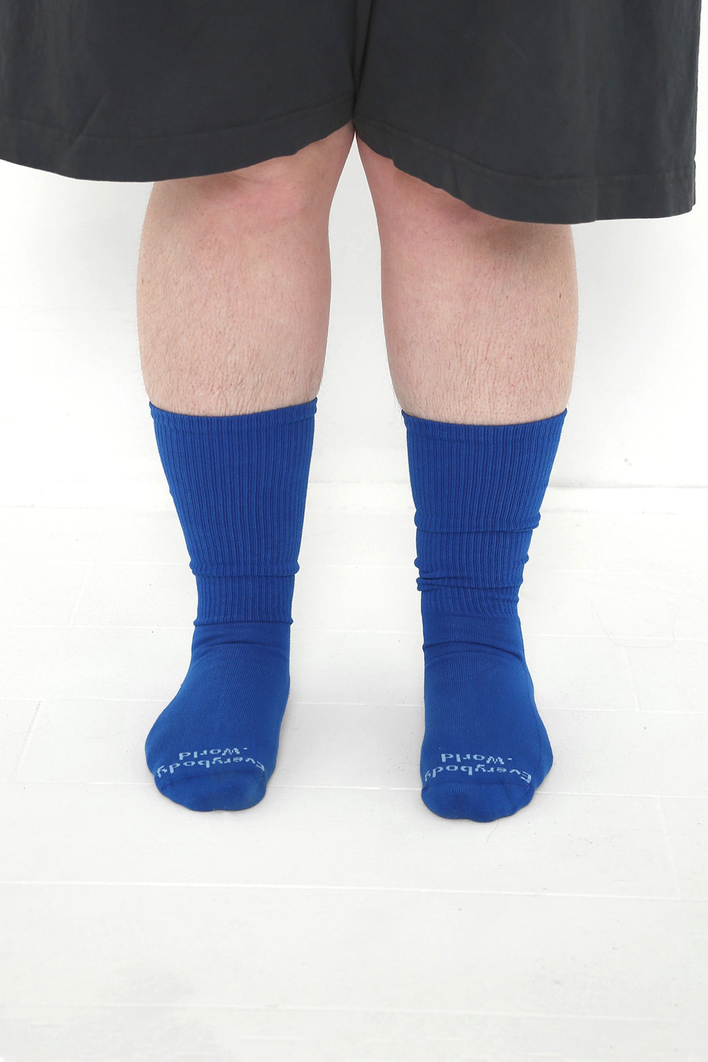 Lapis Socks, branded 'Everybody.World' in white at the toe, mid-calf high.