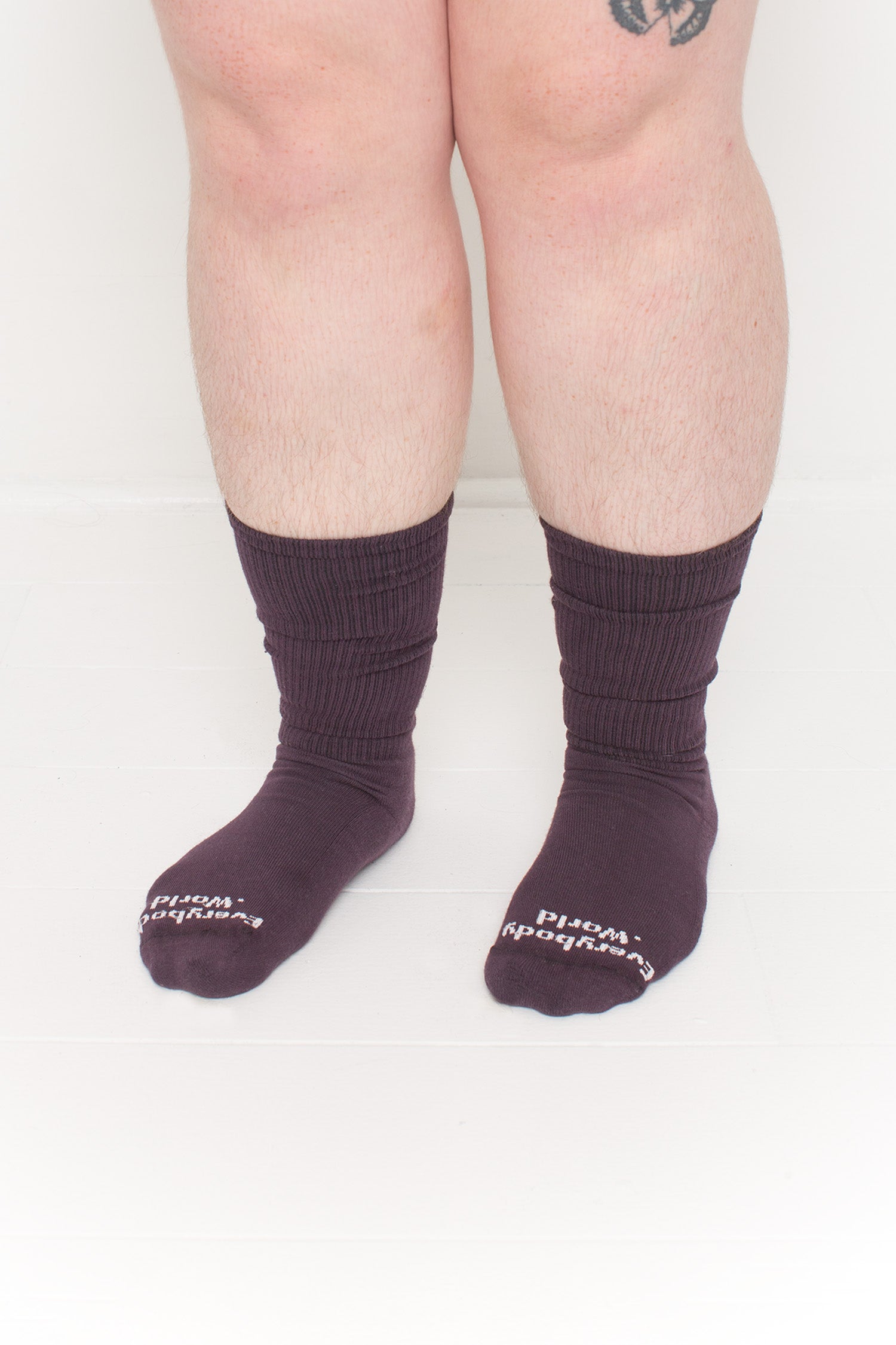 Mulberry Squishy Socks, branded 'Everybody.World' in white at the toe, shown on a person's lower legs.