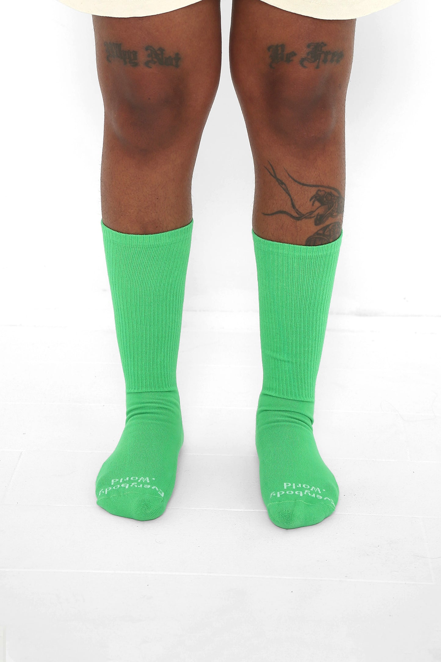 Nice Grass Socks, branded 'Everybody.World' in white at the toe, mid-calf high.
