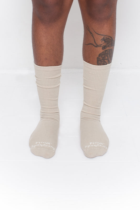 Oat Squishy Socks, branded 'Everybody.World' in white at the toe.