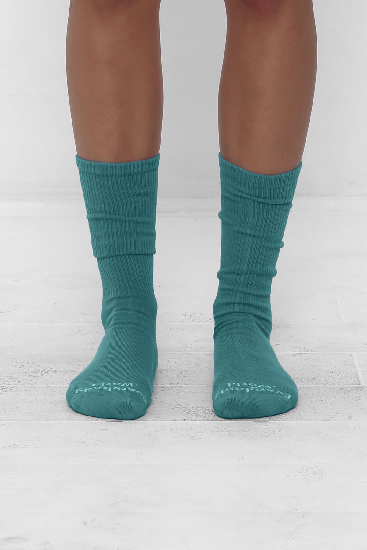 Oyster Socks, branded 'Everybody.World' in white at the toe, mid-calf high.