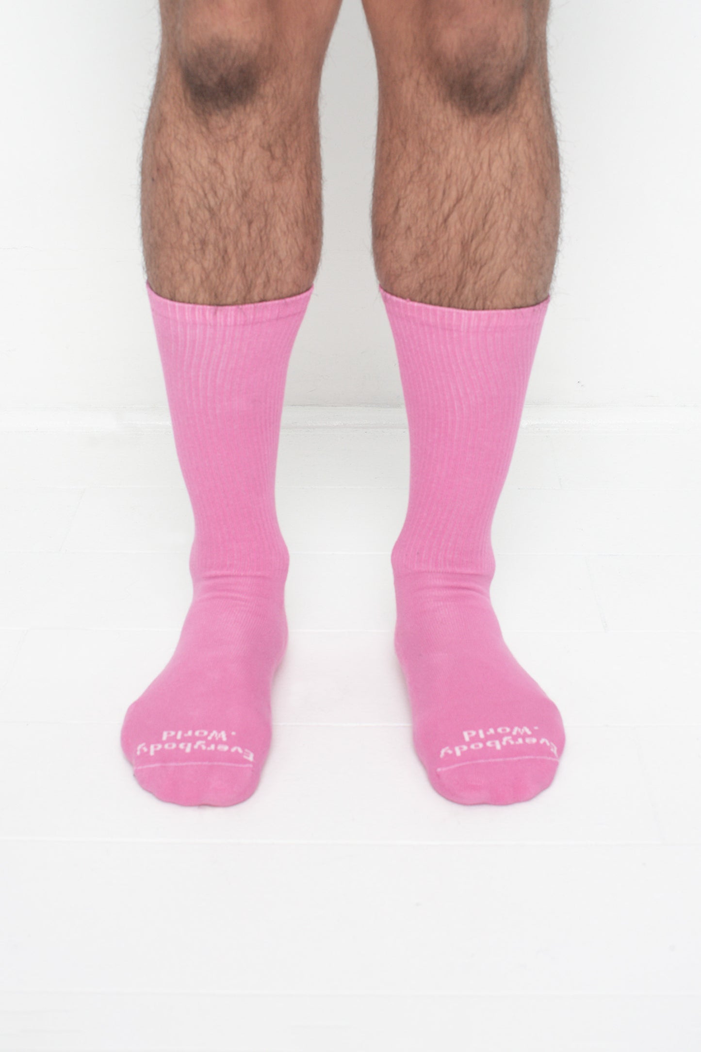 Pixie Squishy Socks, branded 'Everybody.World' in white at the toe, shown on a person's lower legs.