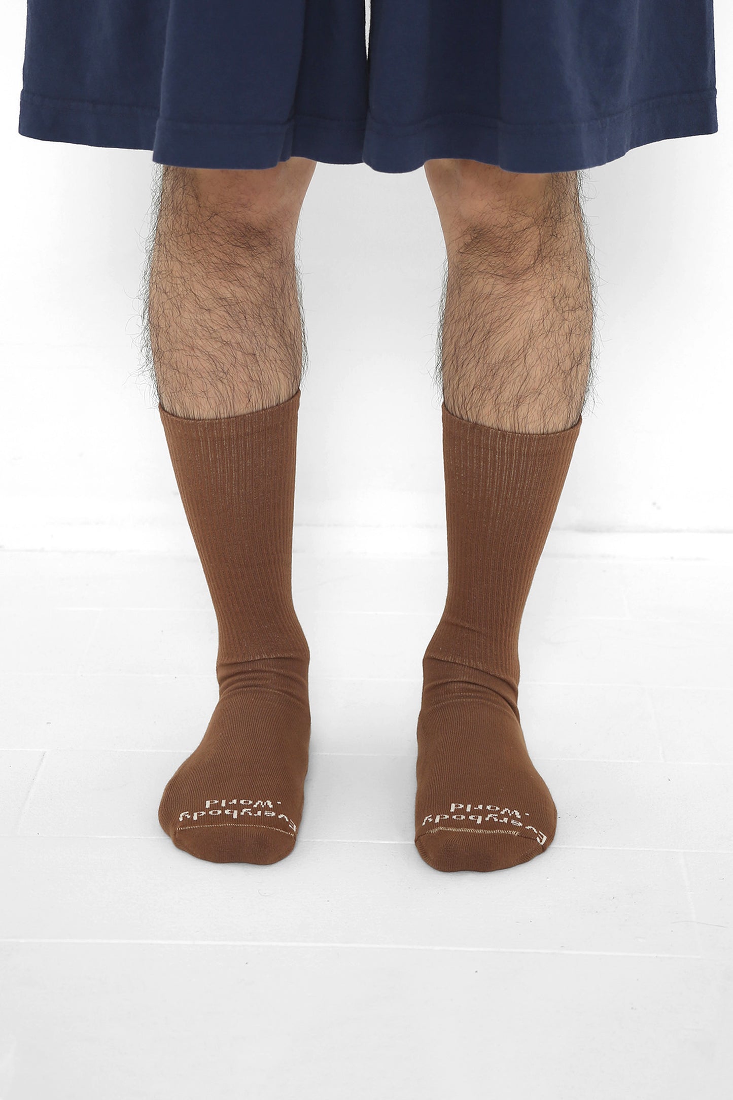 Potting Soil Socks, branded 'Everybody.World' in white at the toe, mid-calf high.