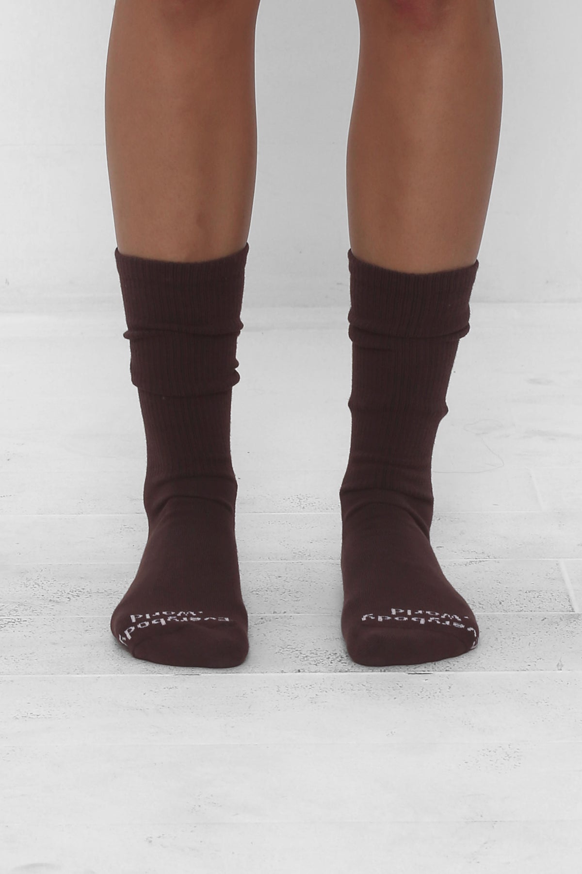Wet Soil Socks, branded 'Everybody.World' in white at the toe, mid-calf high.