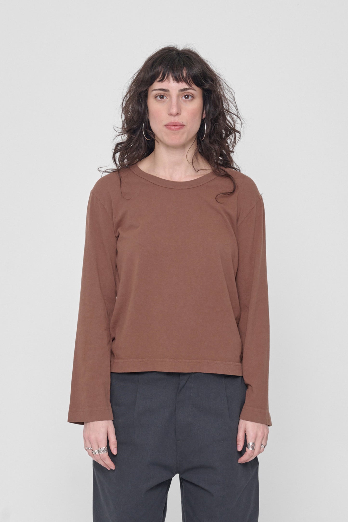 5'6" woman in a size S Potting Soil Straight Sleeve Tailored Trash Tee. Hem at upper-middle hip. 