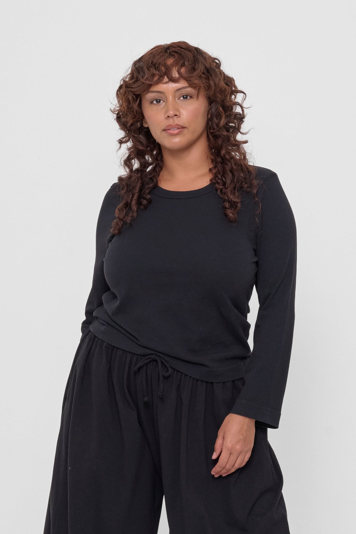 Straight Sleeve Tailored Trash Tee in Black - front view on model