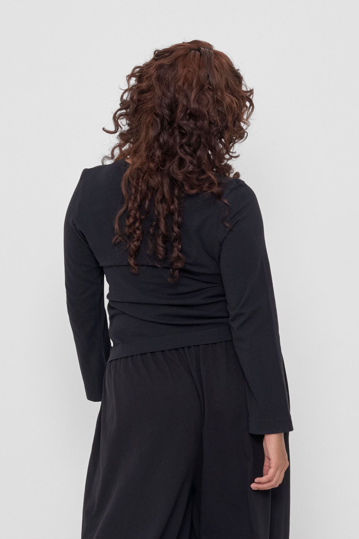 Straight Sleeve Tailored Trash Tee in Black - back view on model