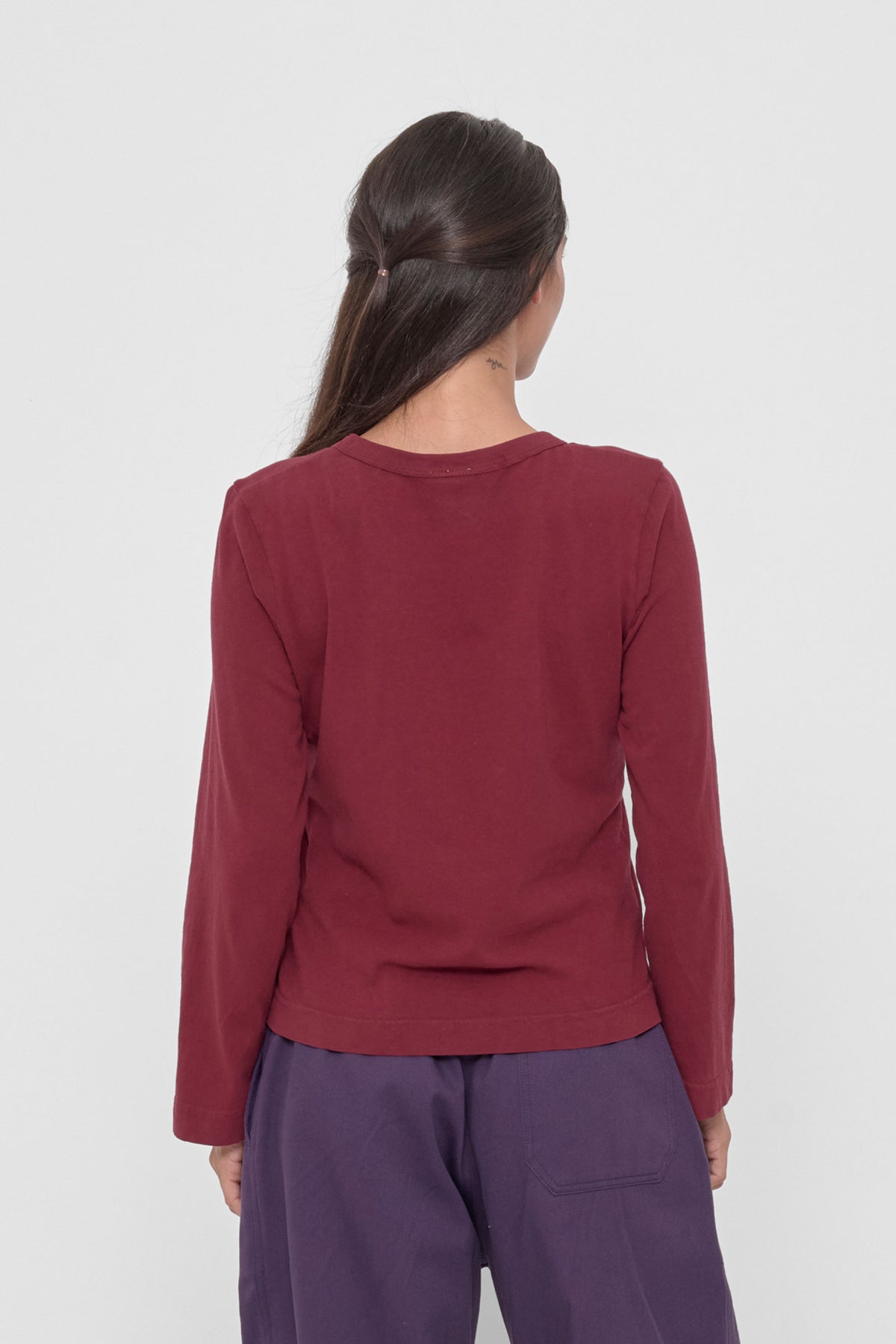 Straight Sleeve Tailored Trash Tee in Garnet – back view on model