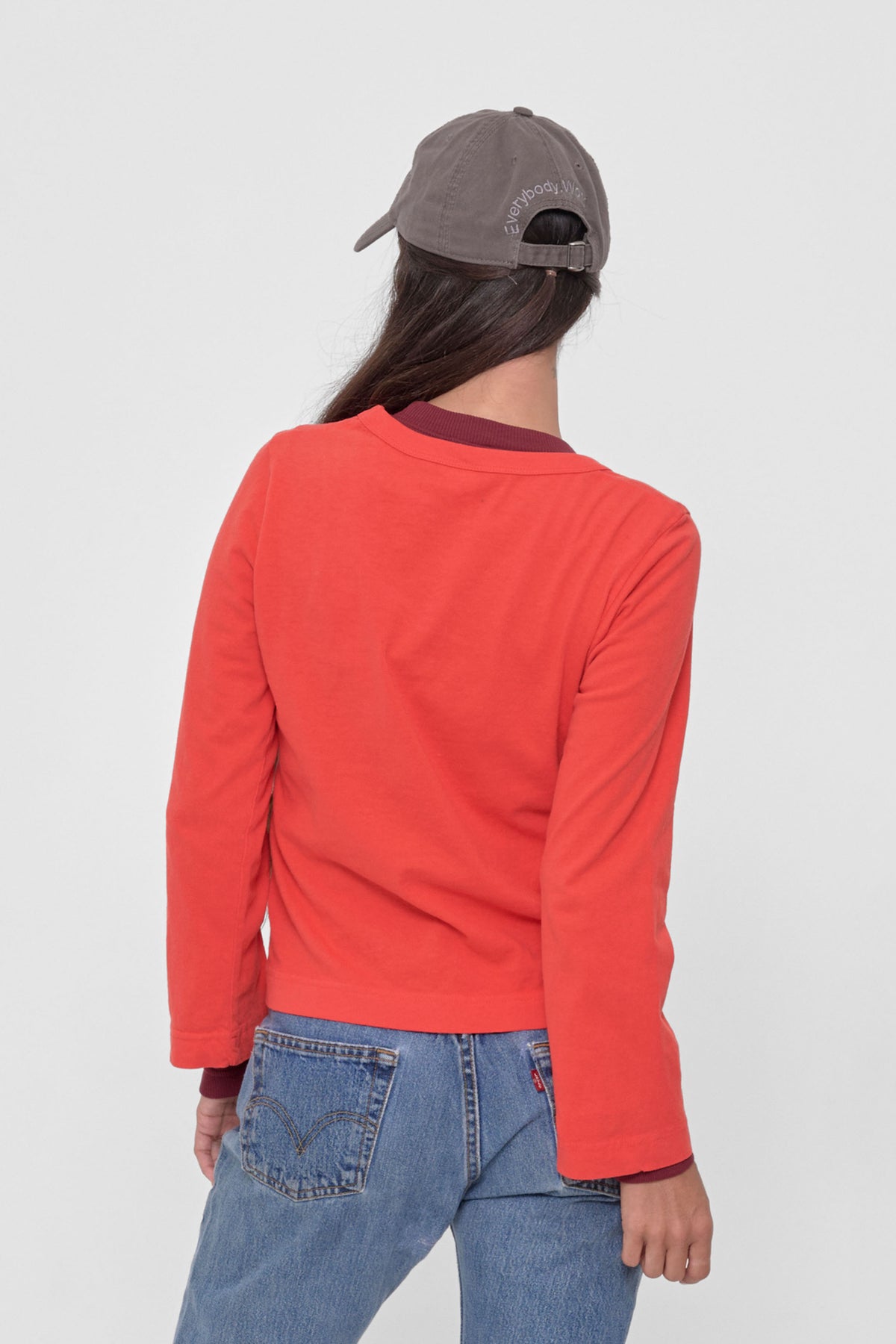 Straight Sleeve Tailored Trash Tee in Lava – back view on model