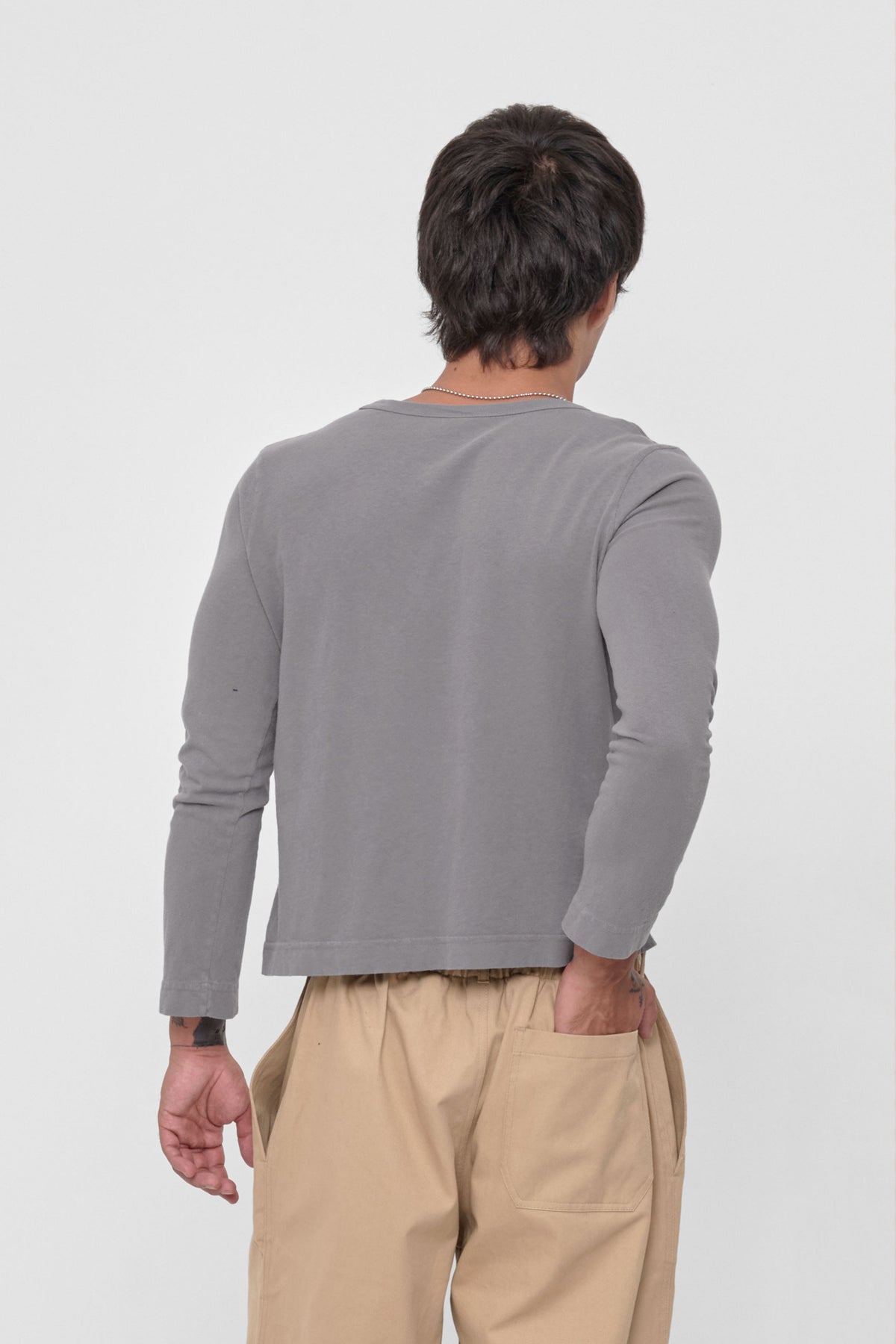 Straight Sleeve Tailored Trash Tee in Stone - back view on model