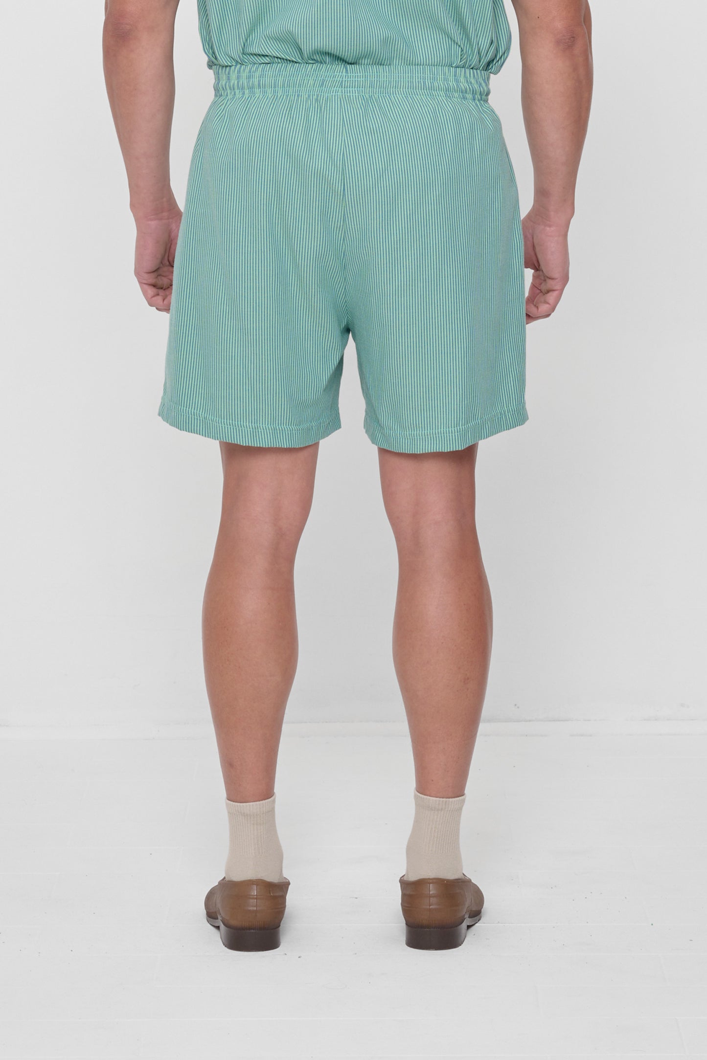 Back view highlights crisp fabric and clean seams.