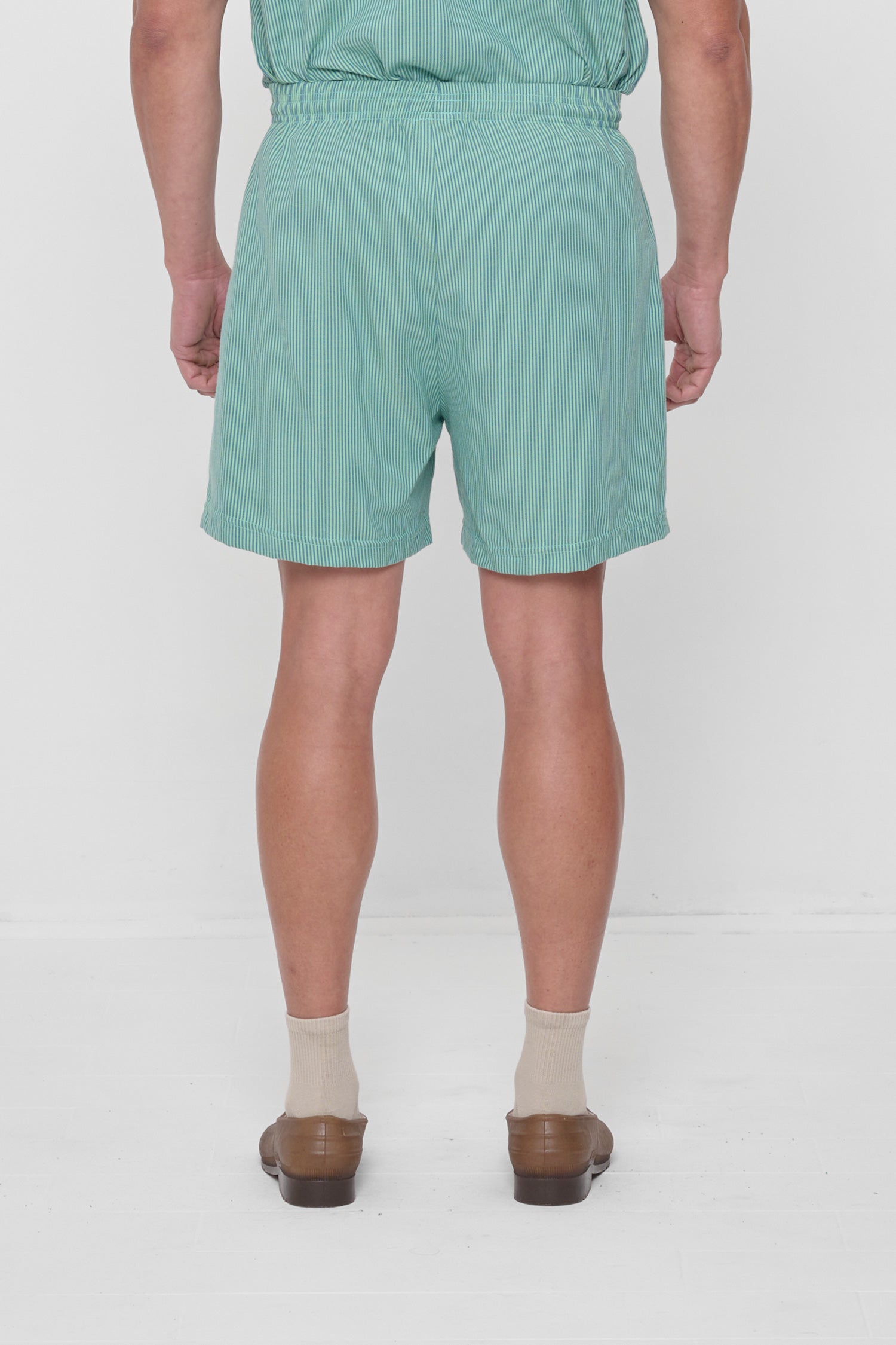 Back view highlights crisp fabric and clean seams.