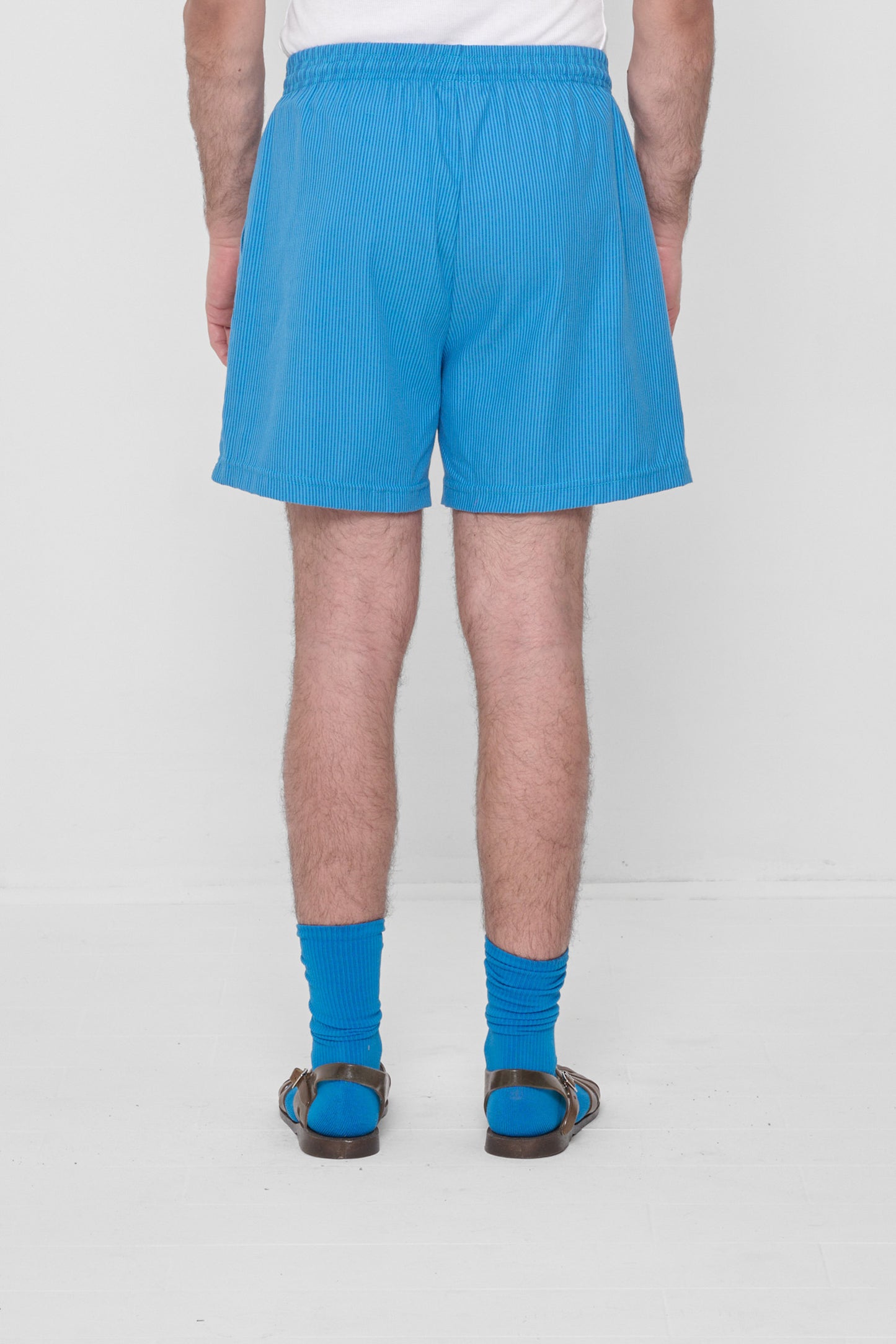 Back view highlights crisp fabric and clean seams.