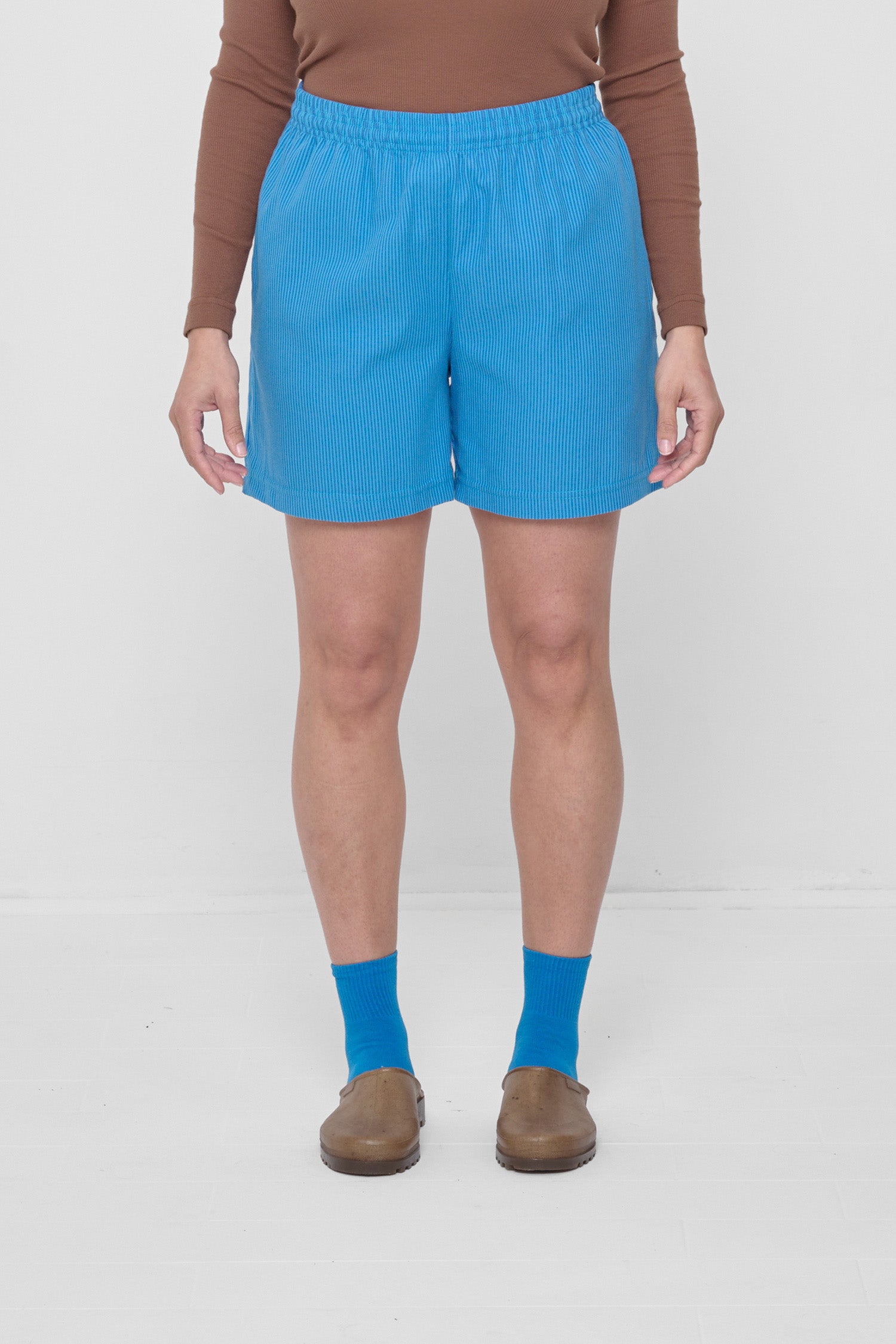 Size L Malibu Stripe Everyday Shorts on a 5'4" model. Hem hits their upper-mid thigh.