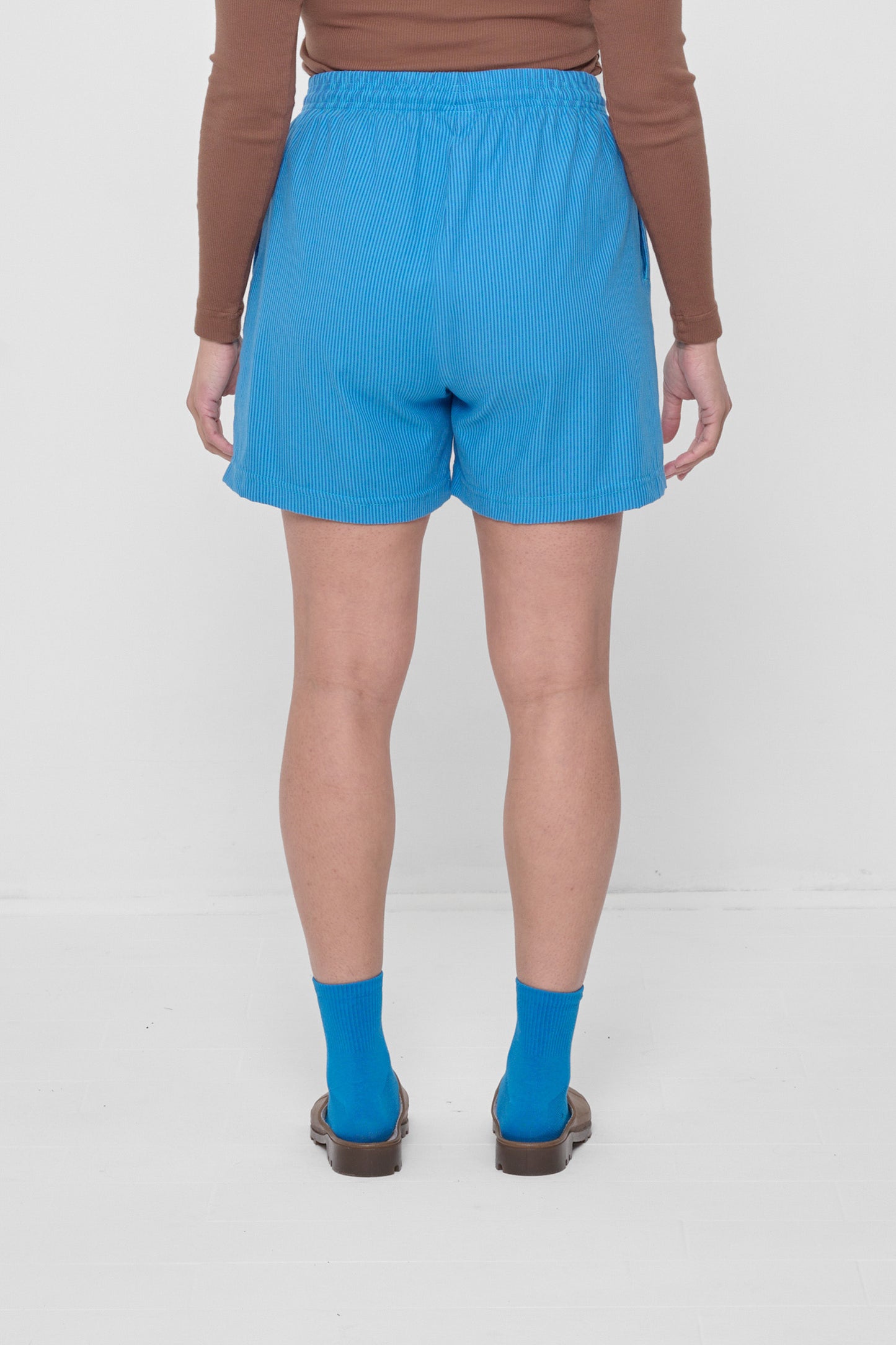 Back view highlights crisp fabric and clean seams.