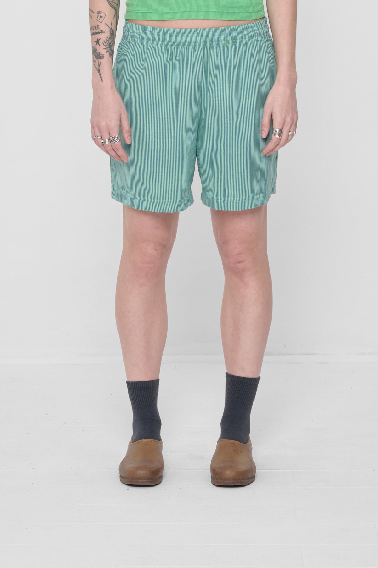 Size M Nice Grass Stripe Everyday Shorts on a 5'6" model. Hem hits their mid thigh.