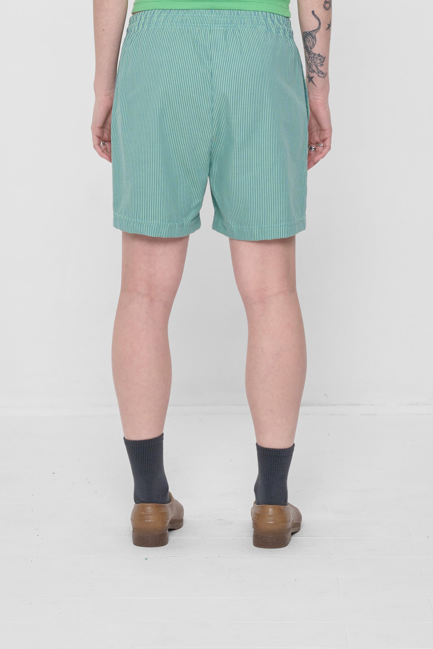 Back view highlights crisp fabric and clean seams.