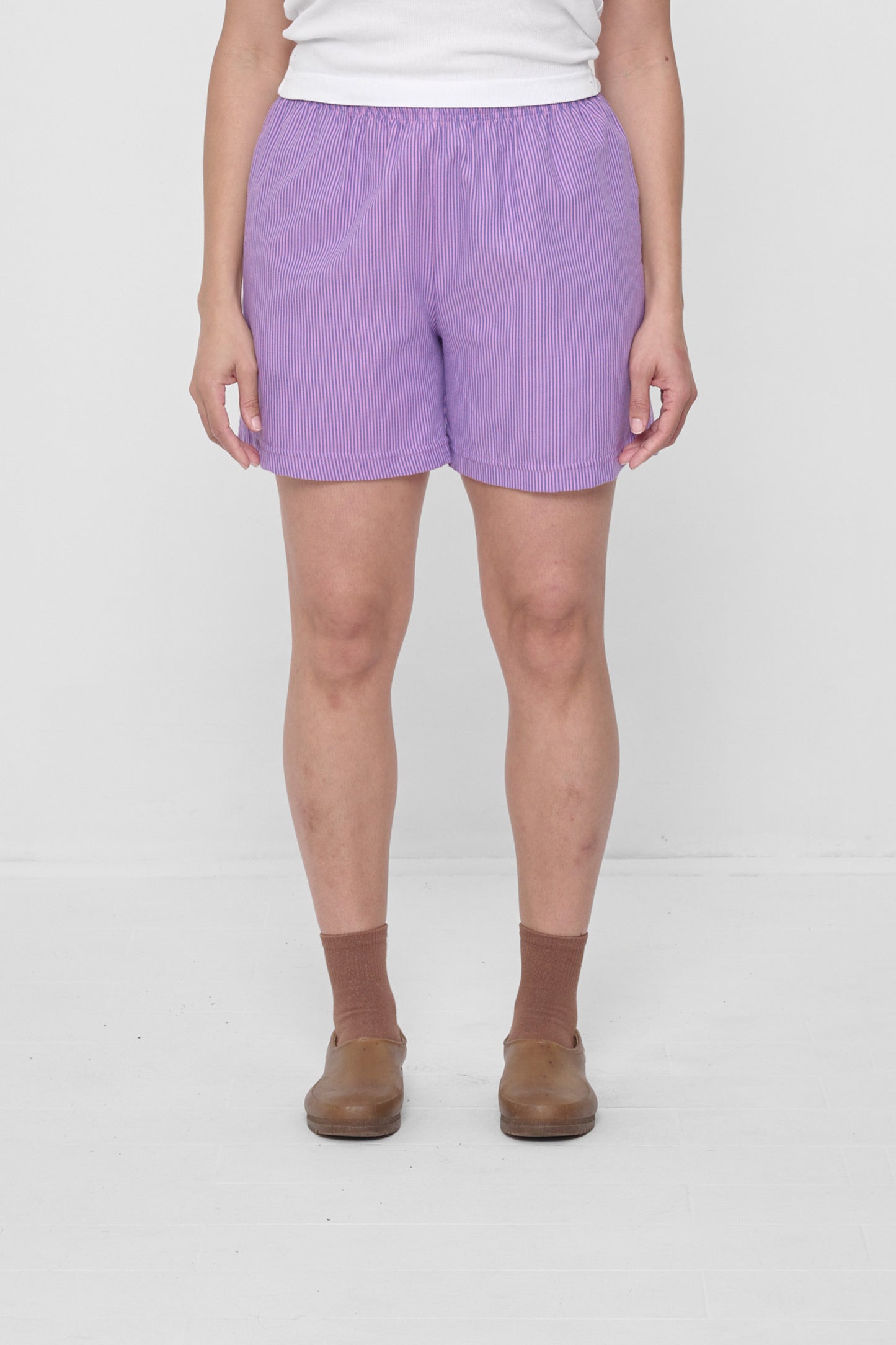 Size L Pixie Stripe Everyday Shorts on a 5'4" model. Hem hits their upper-mid thigh.