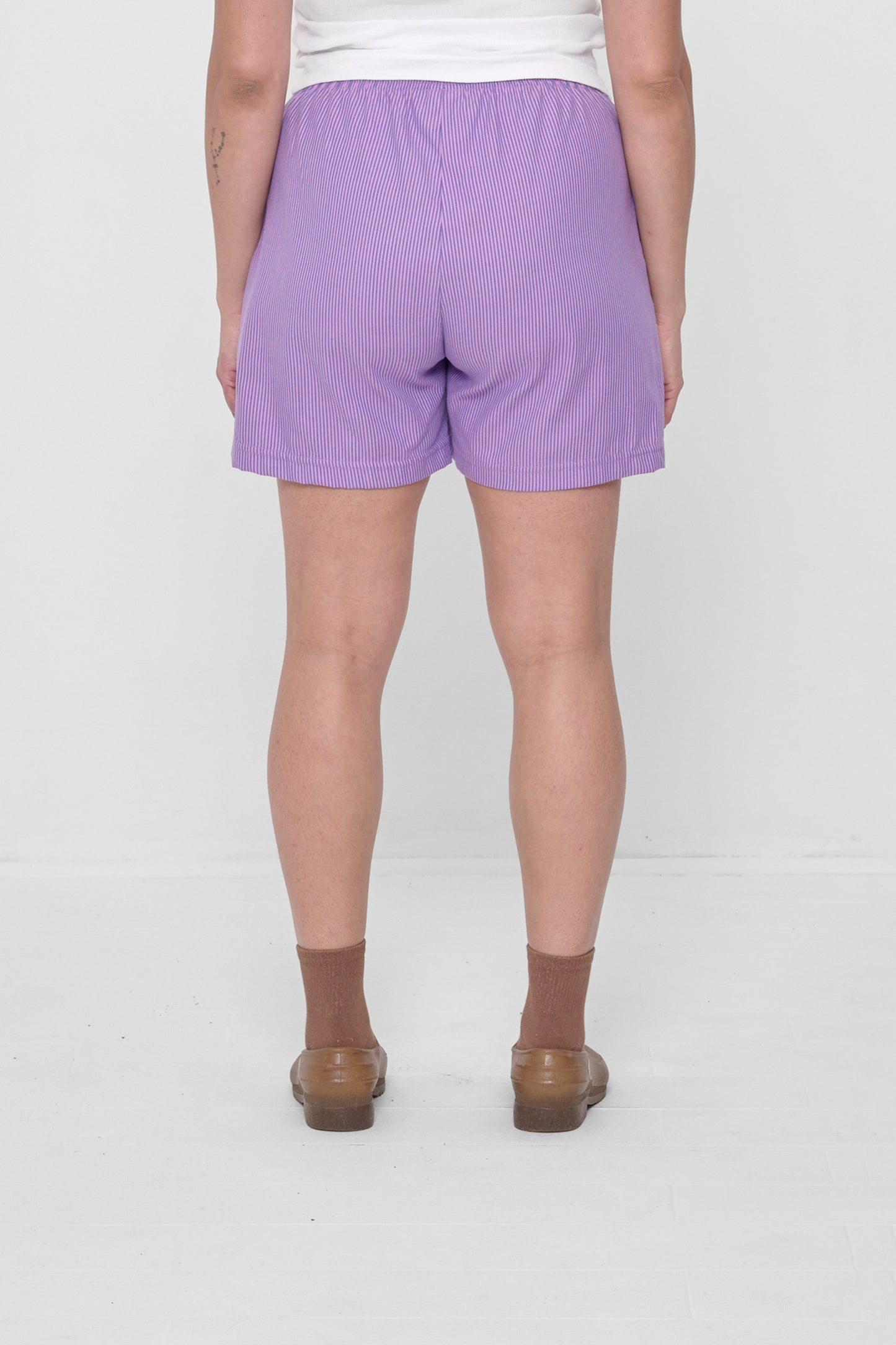 Back view highlights crisp fabric and clean seams.