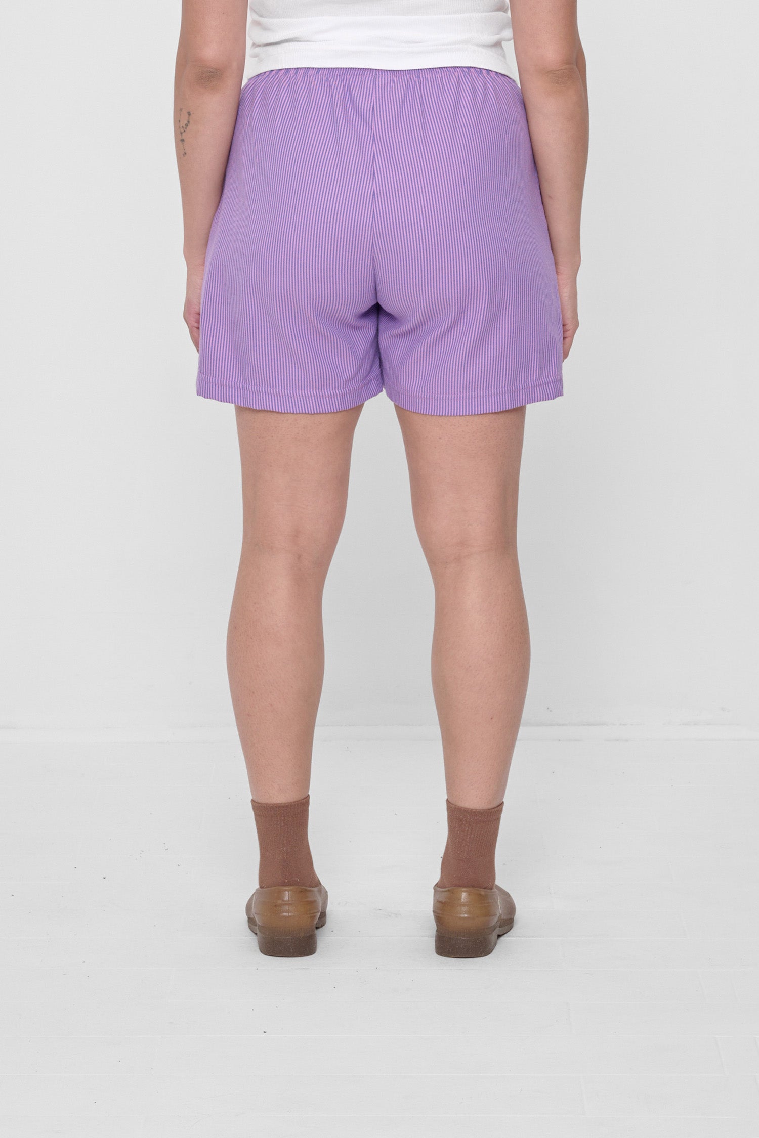 Back view highlights crisp fabric and clean seams.