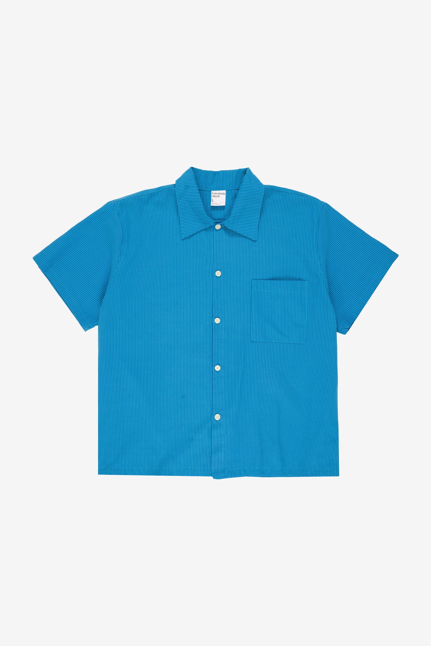 Flat lay front view showing crisp woven fabric texture, stripe pattern, and boxy rectangular cut.