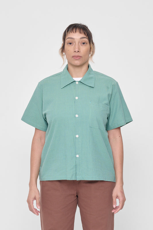 5'4" woman in size M Nice Grass Stripe Short Sleeve Button-Up Shirt. Hem hits her at lower hip. 