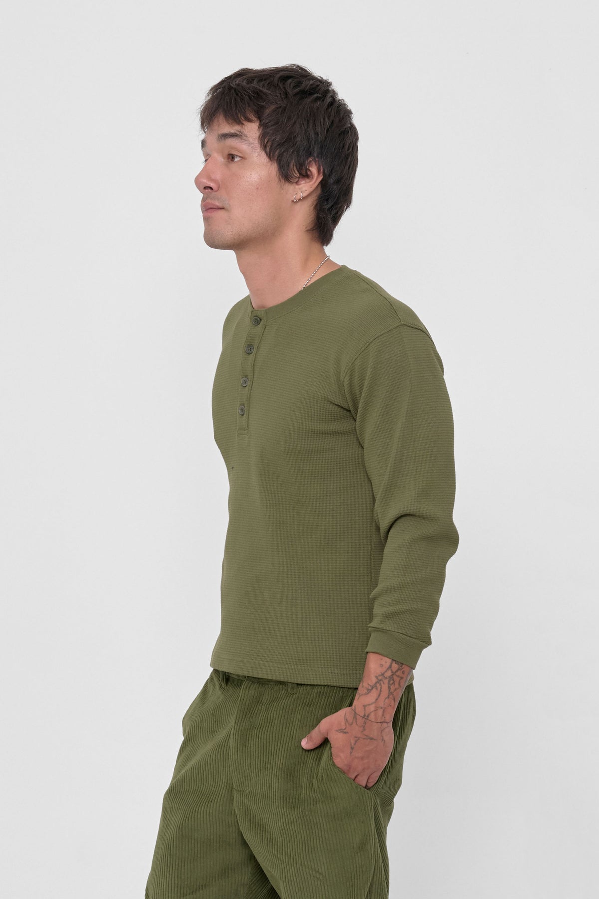 Thermal Henley Trash Tee in Olive – side view on model