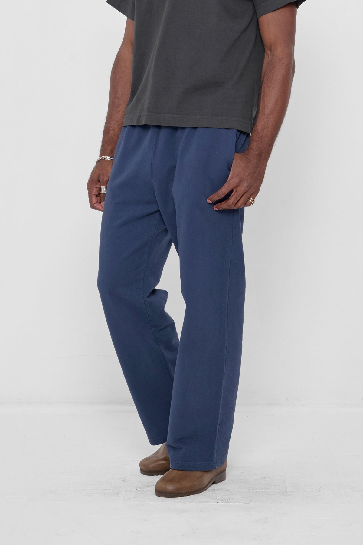 Trash Fleece Apartment Pants in Washed Navy – 3/4 front view on model
