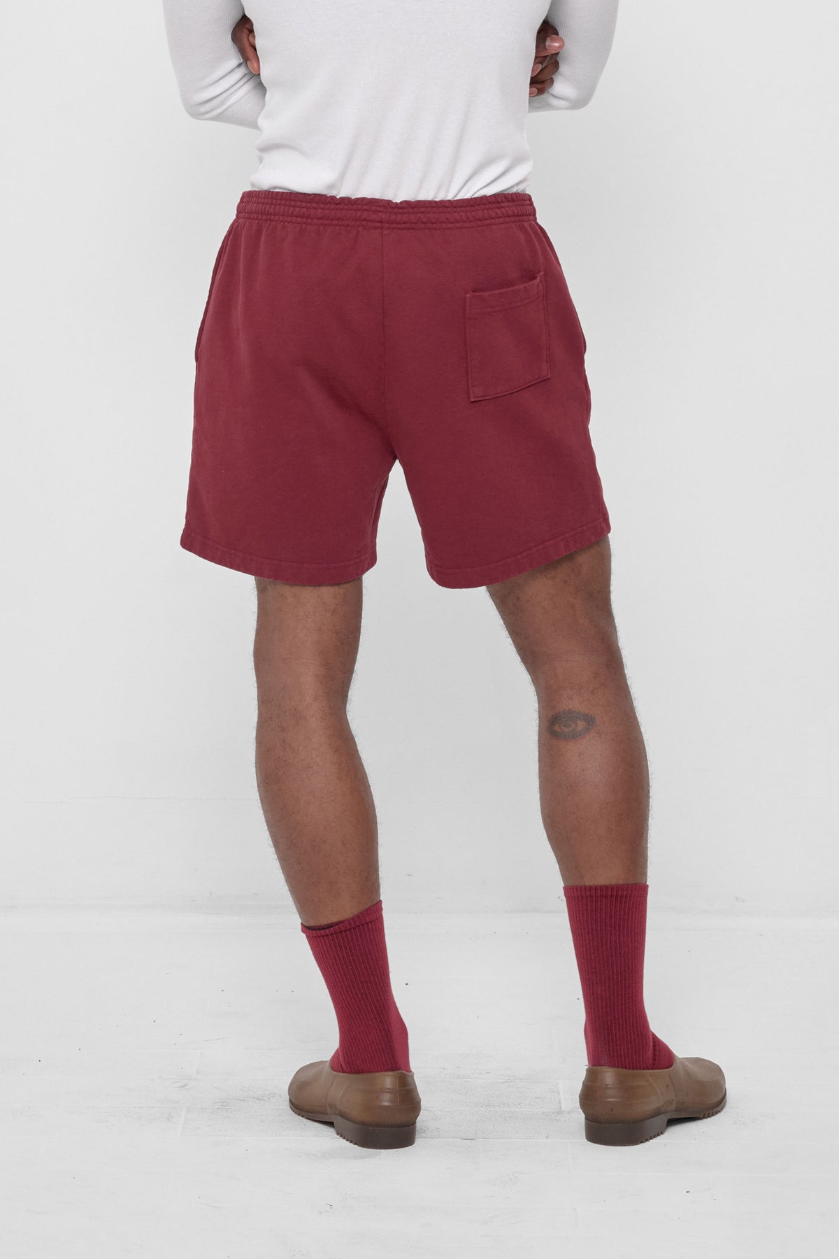 Trash Fleece Everyday Shorts in Garnet – back view on model