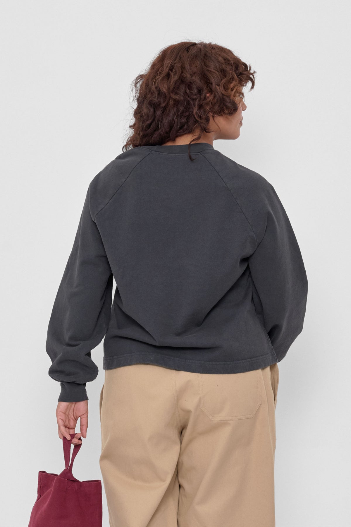 Trash Raglan in Slate - back view on model