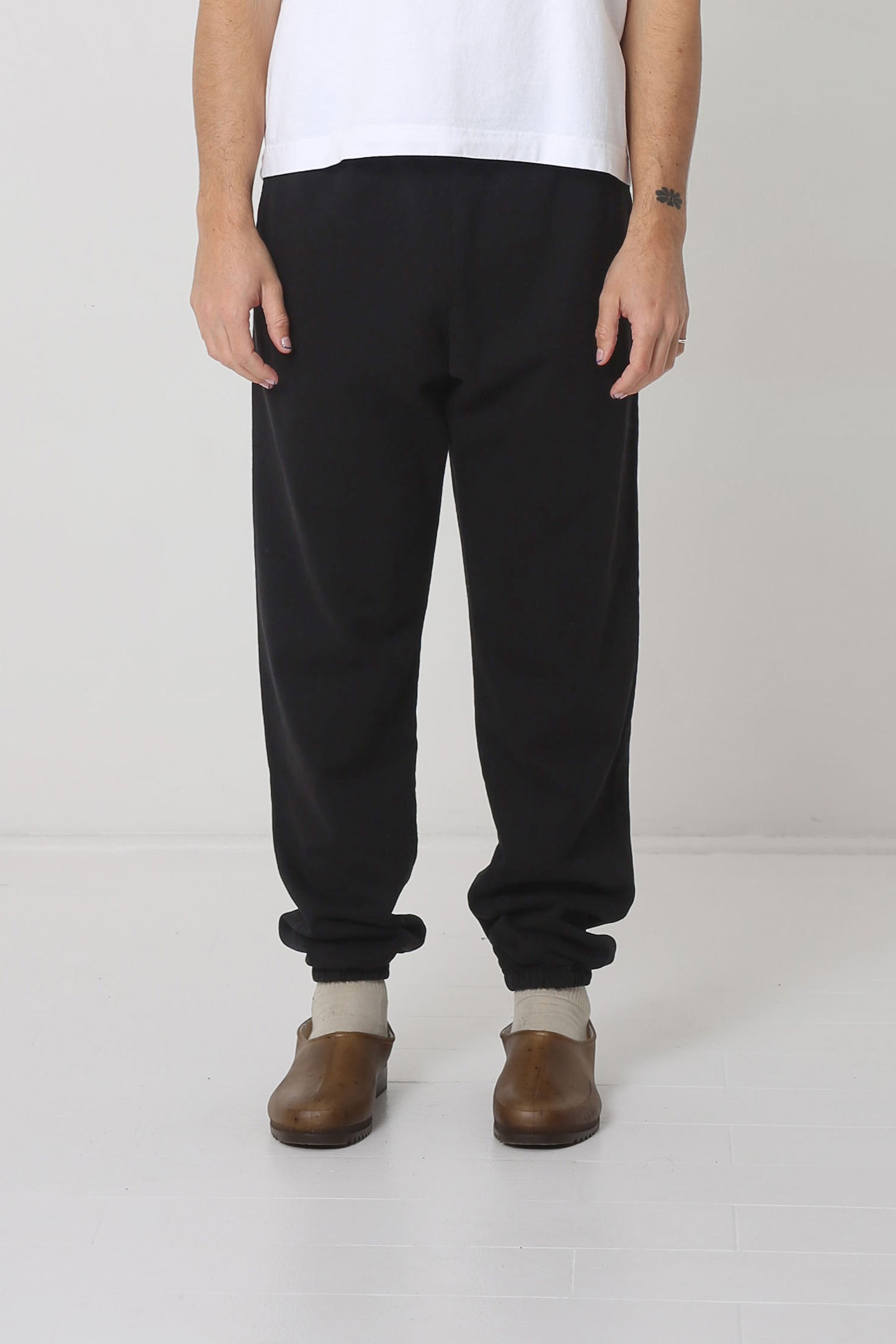 A 6' person in size M Black Trash Sweatpants. Bunching at the ankles.