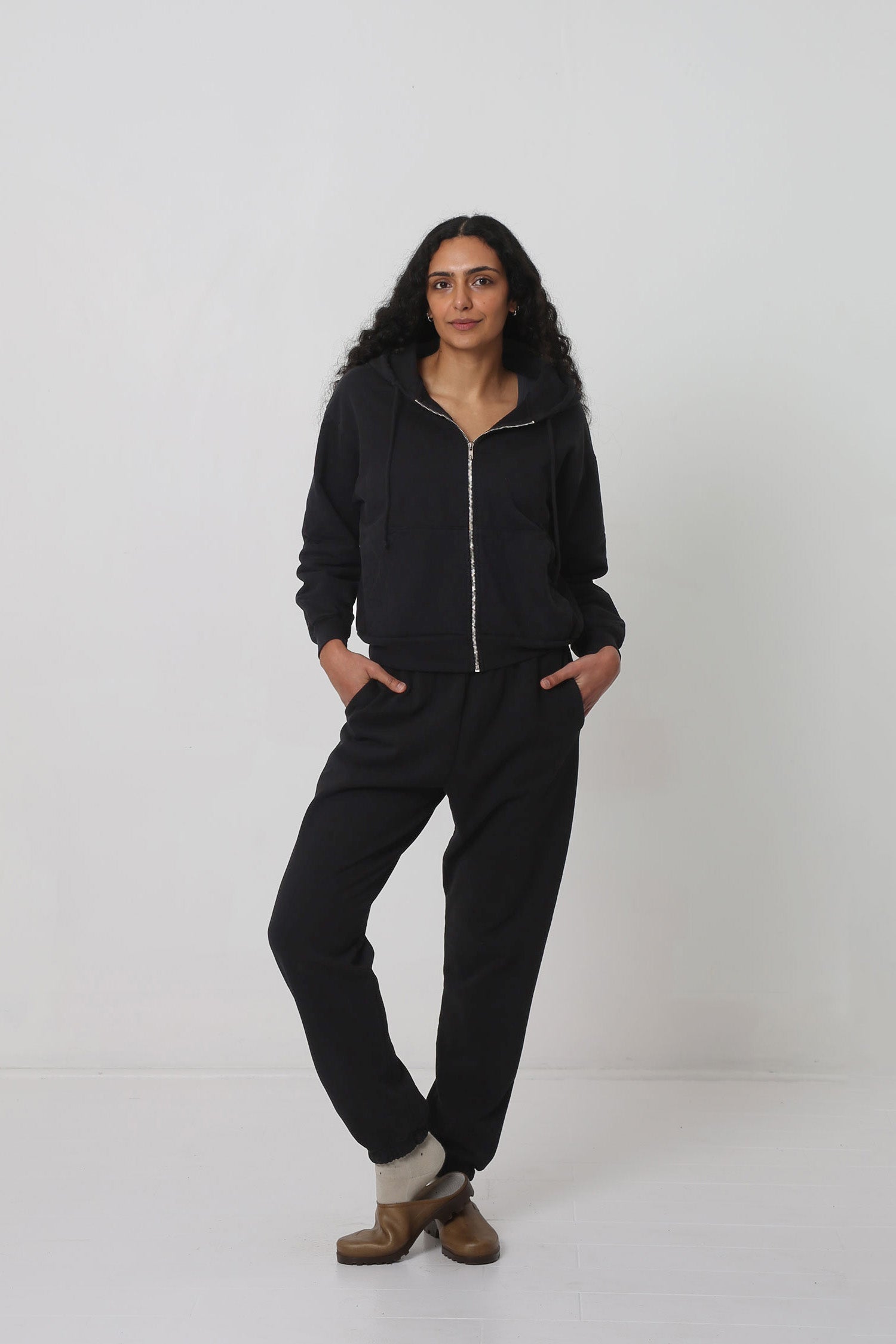 Styled with a Black Trash Zip Up Hoodie and Plasticana Opana Mules.