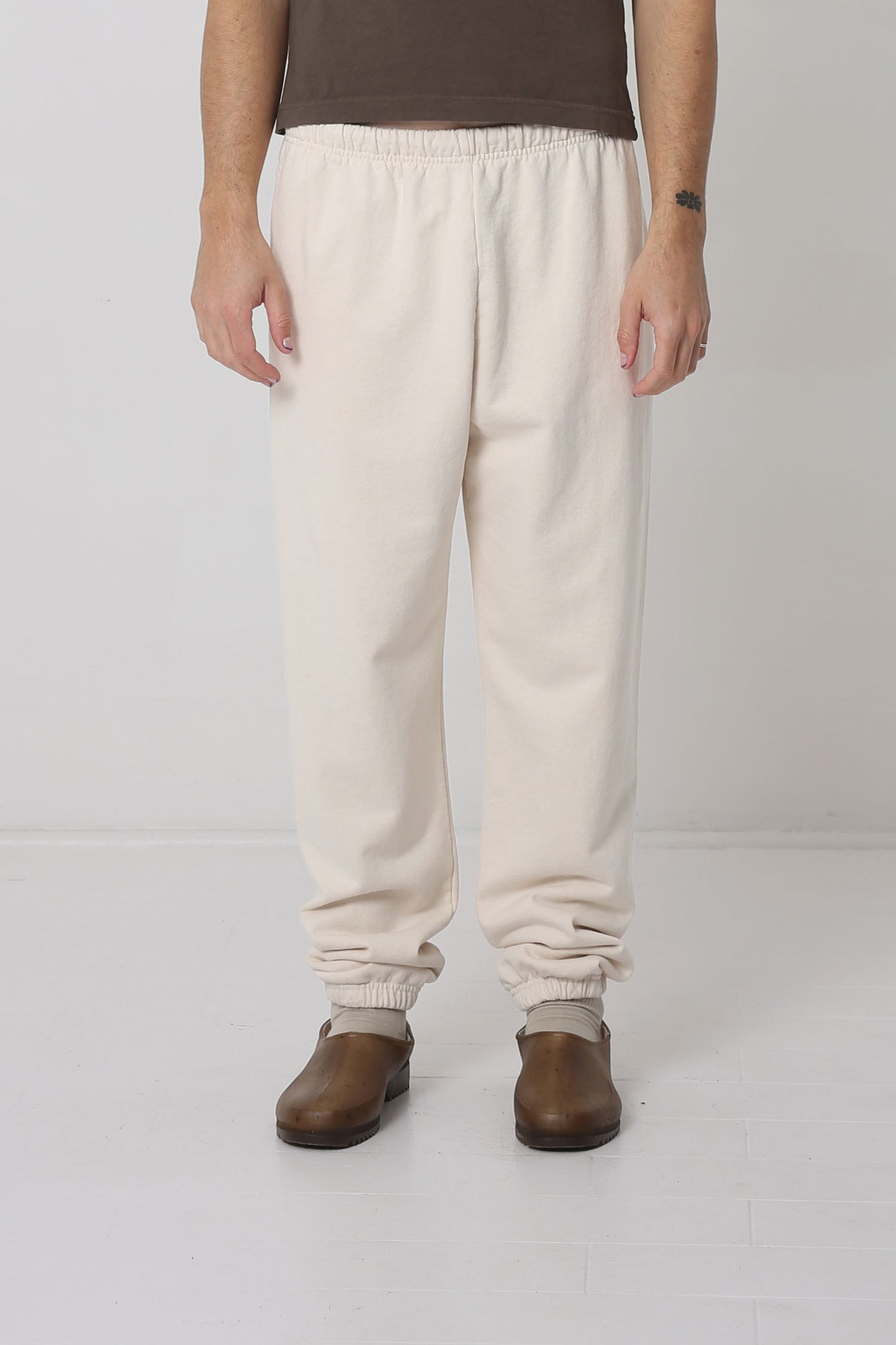 A 6' person in size M Scour Trash Sweatpants. Bunching at the ankles.