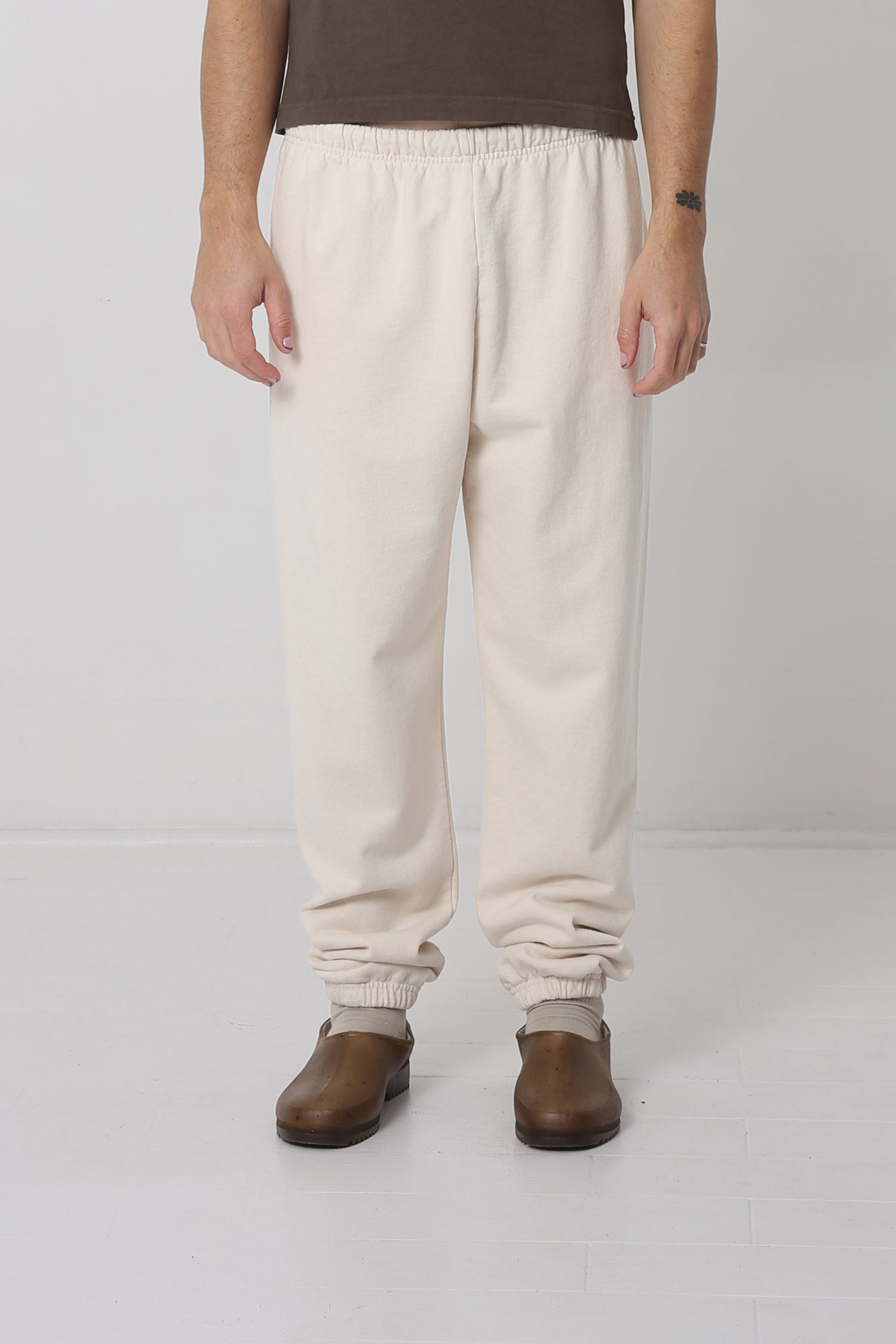 A 6' person in size M Scour Trash Sweatpants. Bunching at the ankles.