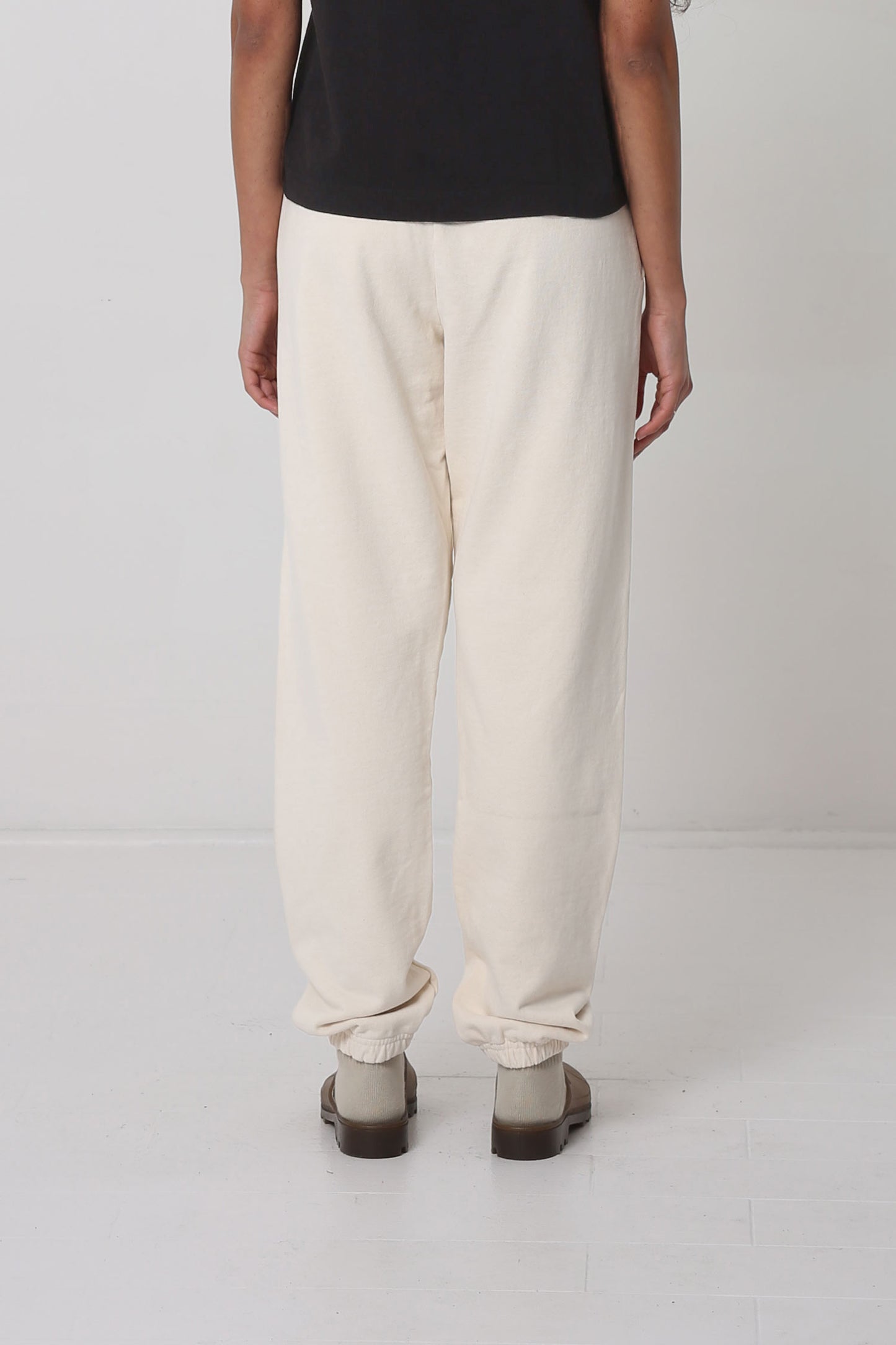 Back view: relaxed fit throughout, except for cuffs at the hem.