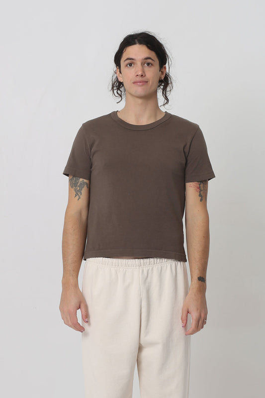 6' person in a size M Dry Soil Tailored Trash Tee. Shirt hem ends at their hip bone. 