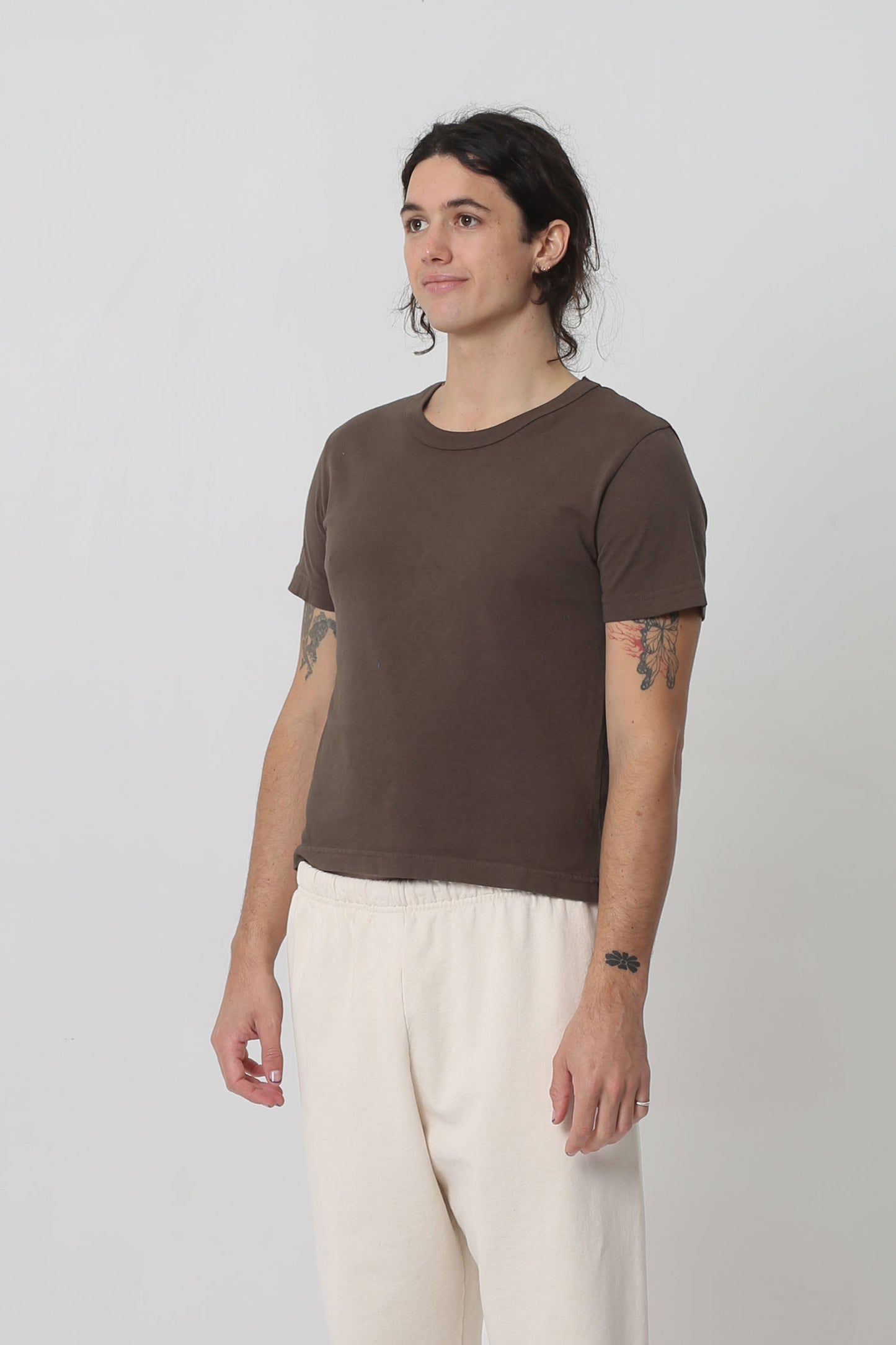 3/4 front view showing side seams and slim short sleeves.