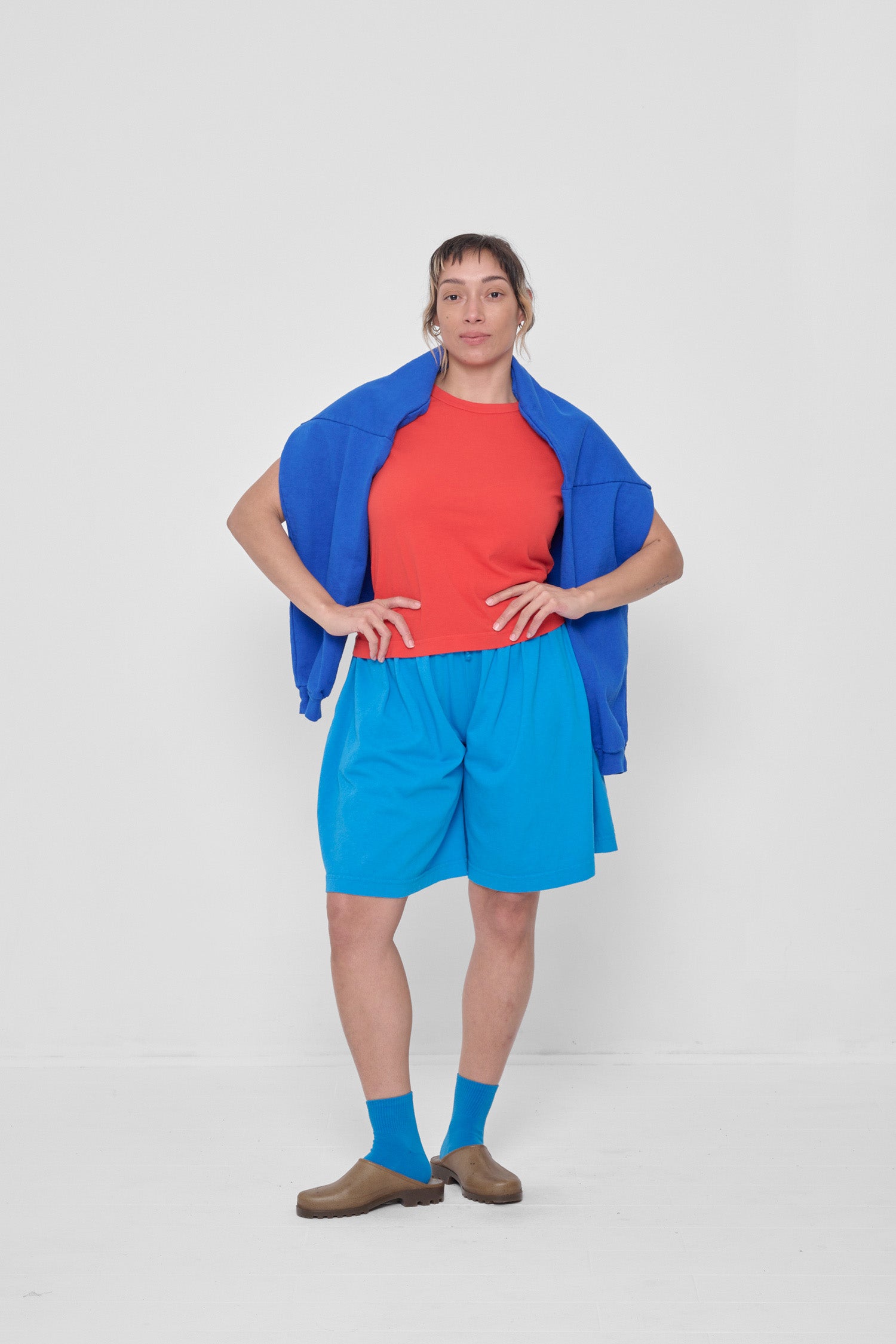 Styled with Malibu Long Tubular Shorts and a Lapis Trash Crewneck draped around model's shoulders.