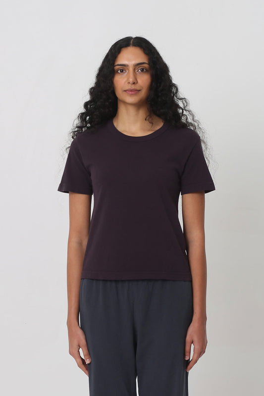 5'10" woman in a Mulberry Tailored Trash Tee in Size S. Shirt hem ends at her upper-middle hip.