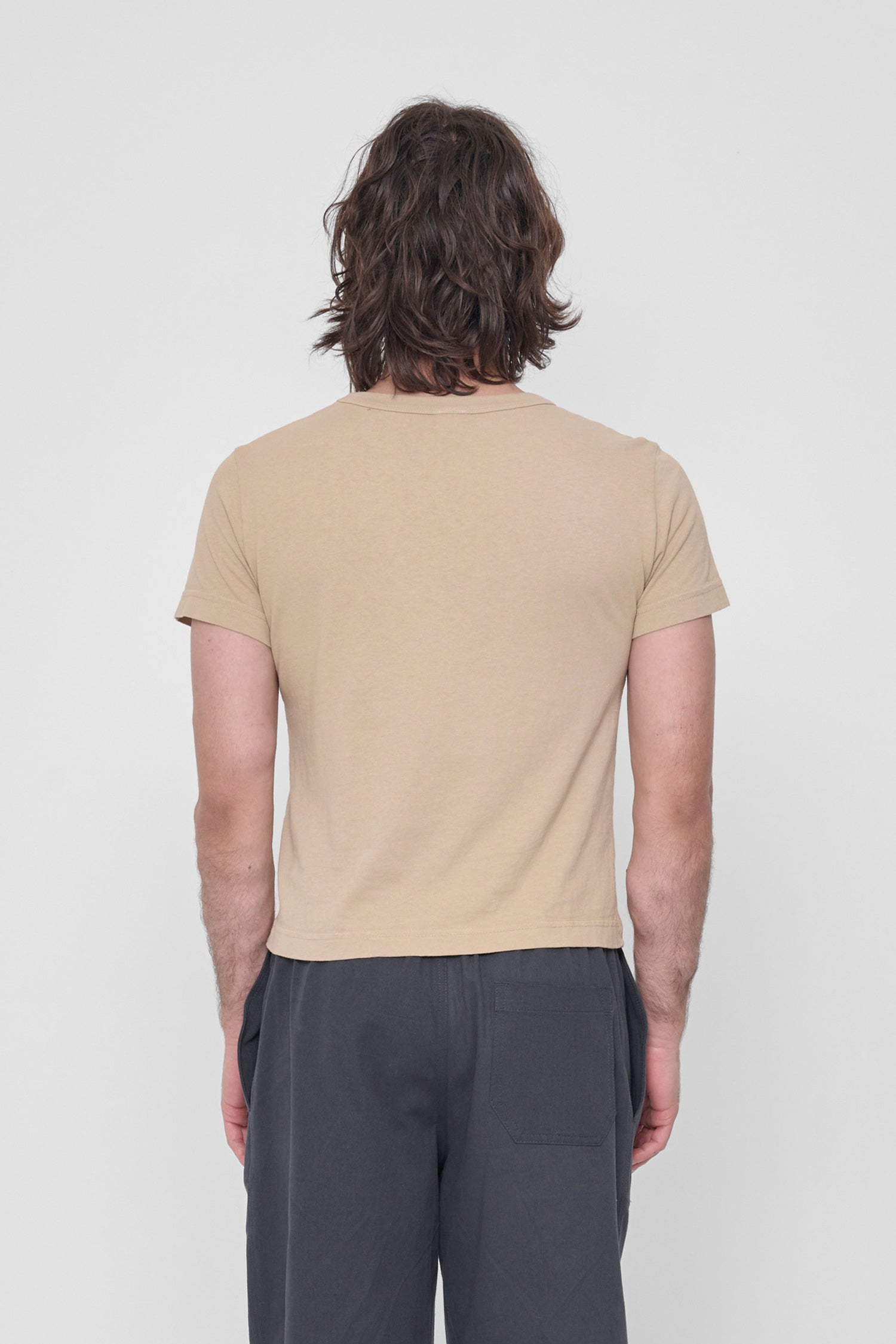 Back view: fitted across upper back with some ease at lower back.