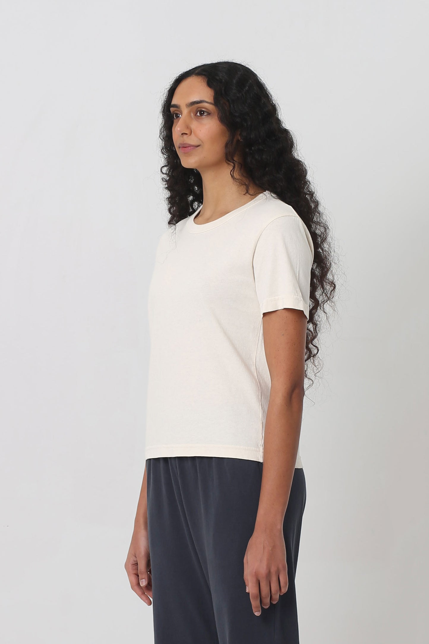 3/4 front view showing side seams and slim short sleeves.