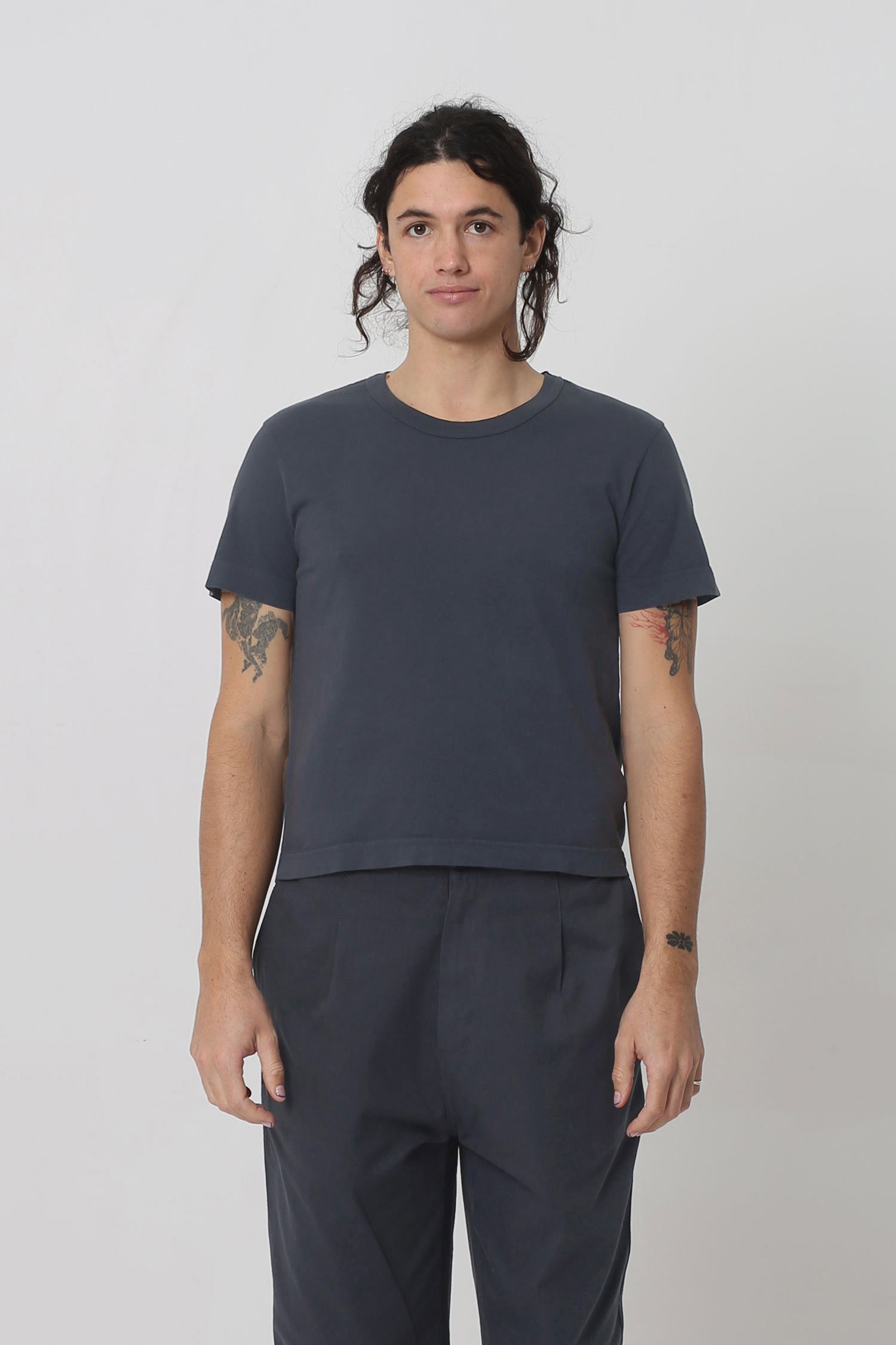 6' person in a Slate Tailored Trash Tee in Size M. Shirt hem ends at their hip bone. 