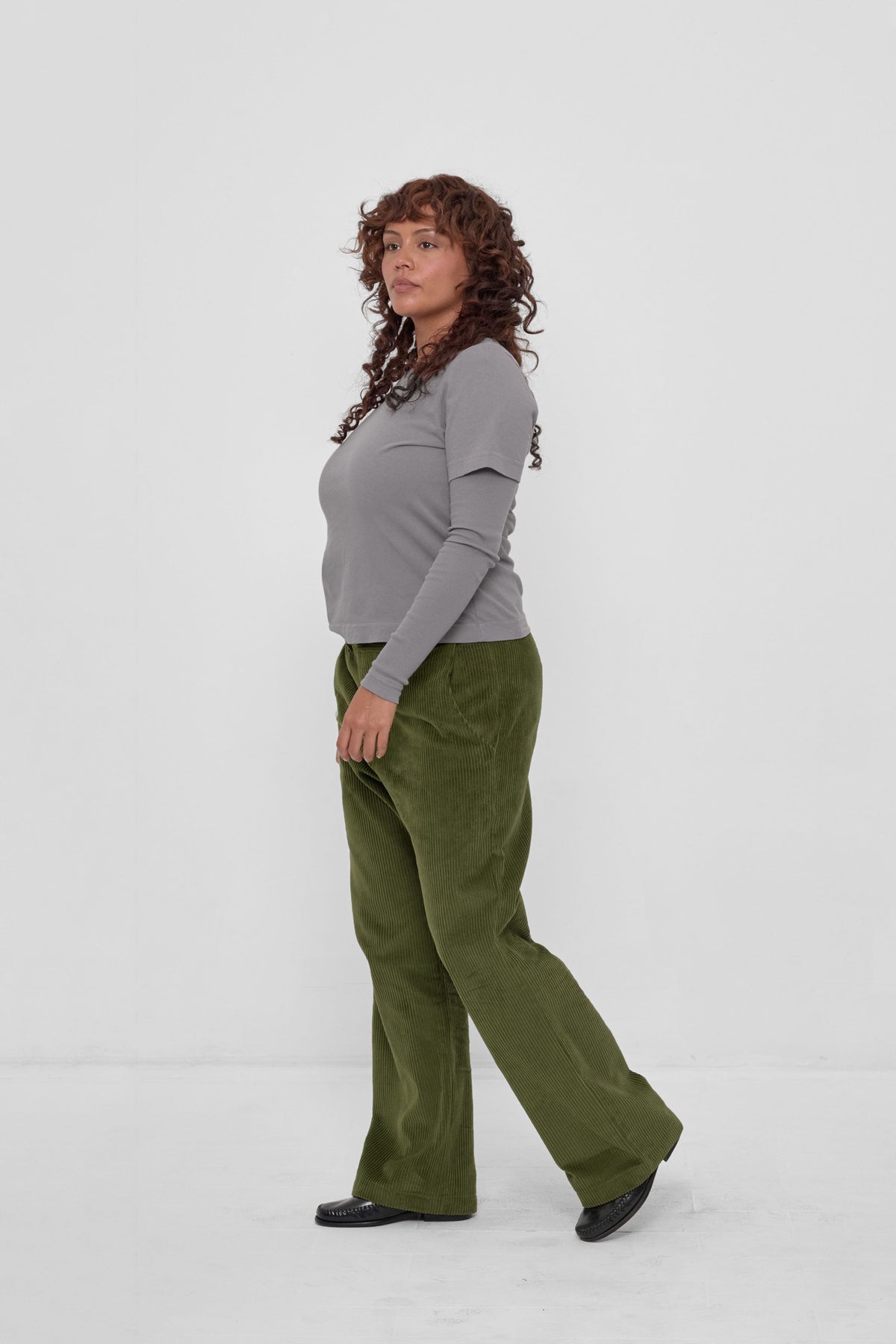 Tailored Trash Tee in Stone - 3/4 view on model, styled with Olive Cord Pants