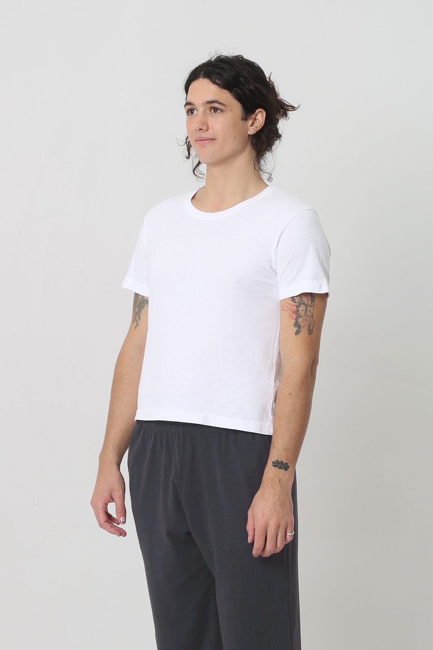 3/4 front view showing side seams and slim short sleeves.